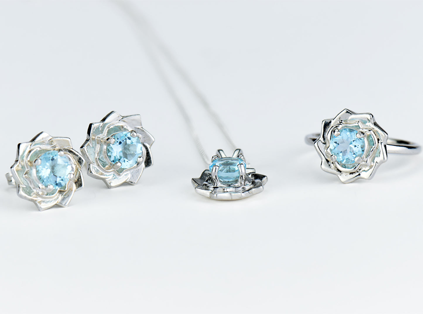 Light blue lotus flower collection.  Matching Sky Blue Topaz Jewelry.