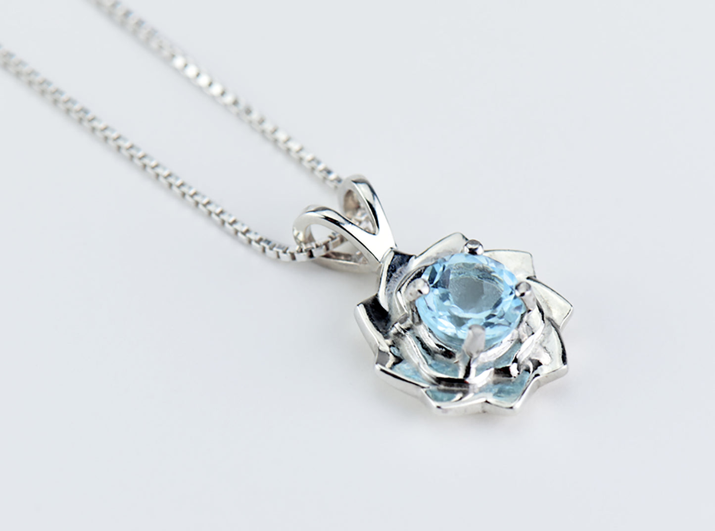 Light blue lotus flower collection.  Matching Sky Blue Topaz Jewelry.