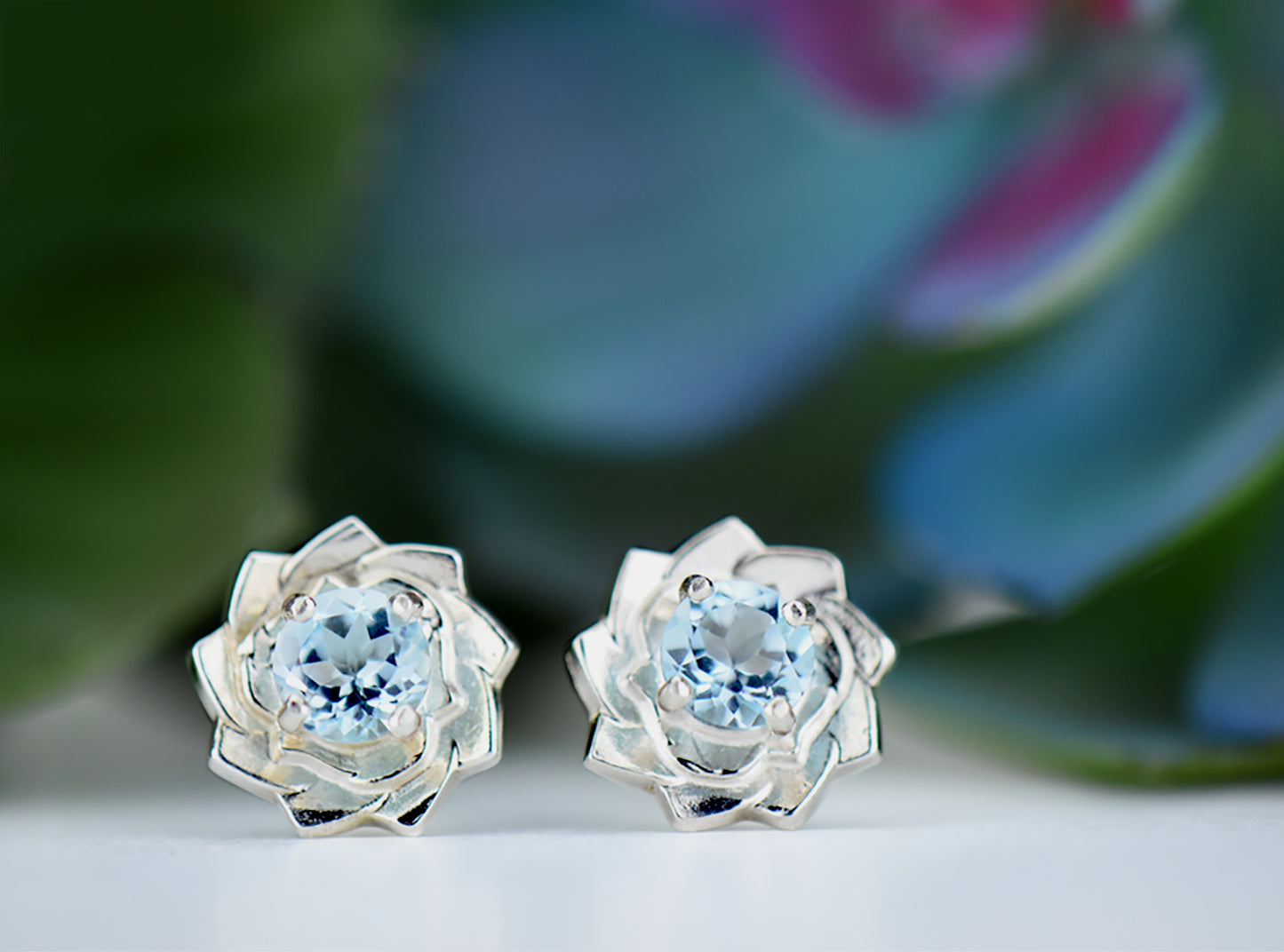 Light Blue Lotus Flower Earrings. Natural, Sky Blue Topaz gemstones set in handmade premium silver earrings.