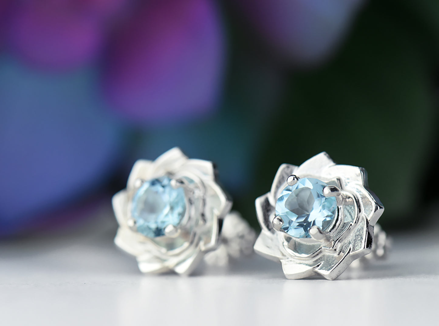 Light Blue Lotus Flower Earrings. Natural, Sky Blue Topaz gemstones set in handmade premium silver earrings.