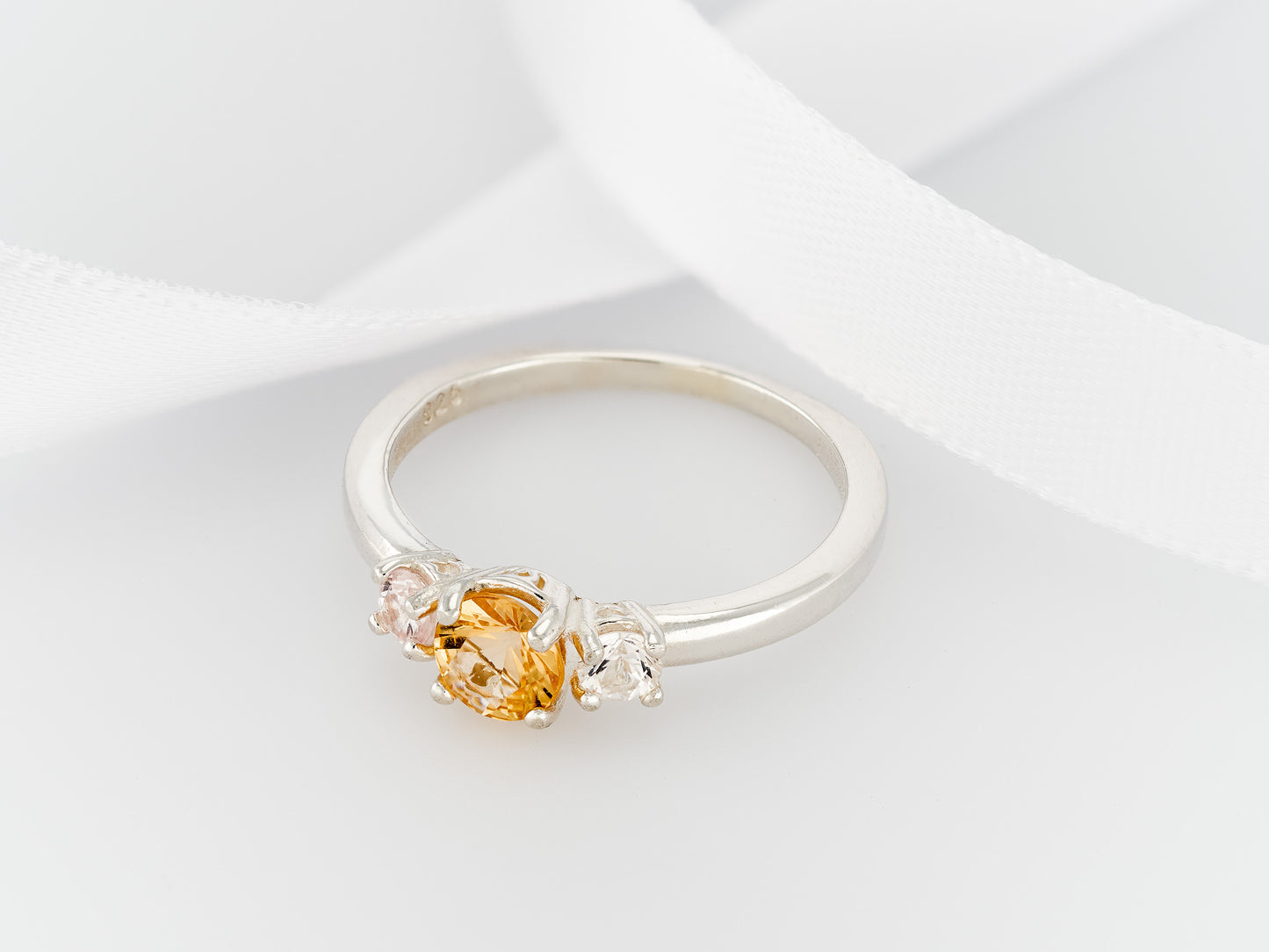 Imperial Topaz ring with white sapphire accents. Three Gem Ring featuring a 5 mm Imperial and 3 mm white sapphires.