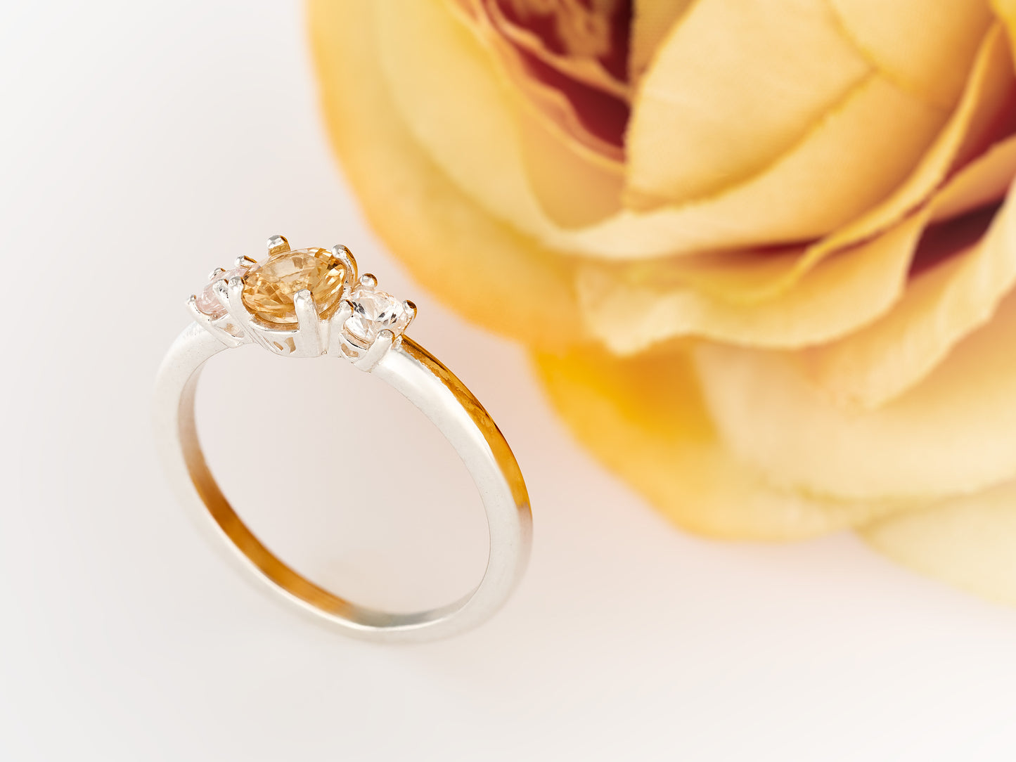 Imperial Topaz ring with white sapphire accents. Three Gem Ring featuring a 5 mm Imperial and 3 mm white sapphires.