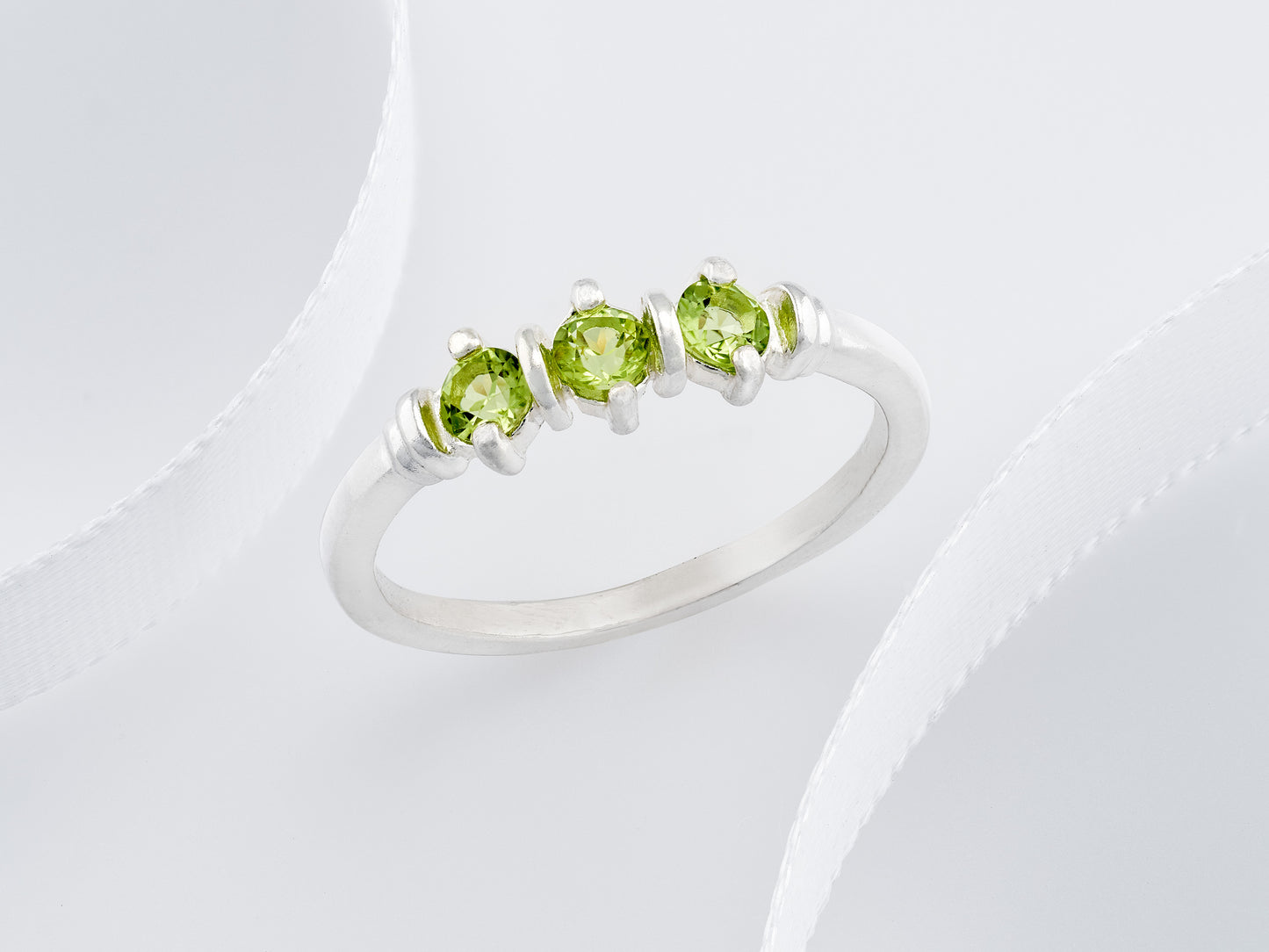 Three-Gemstone Band.  Lively green, natural, peridot!  Three Round Natural Peridot Gemstones set in Sterling Silver.