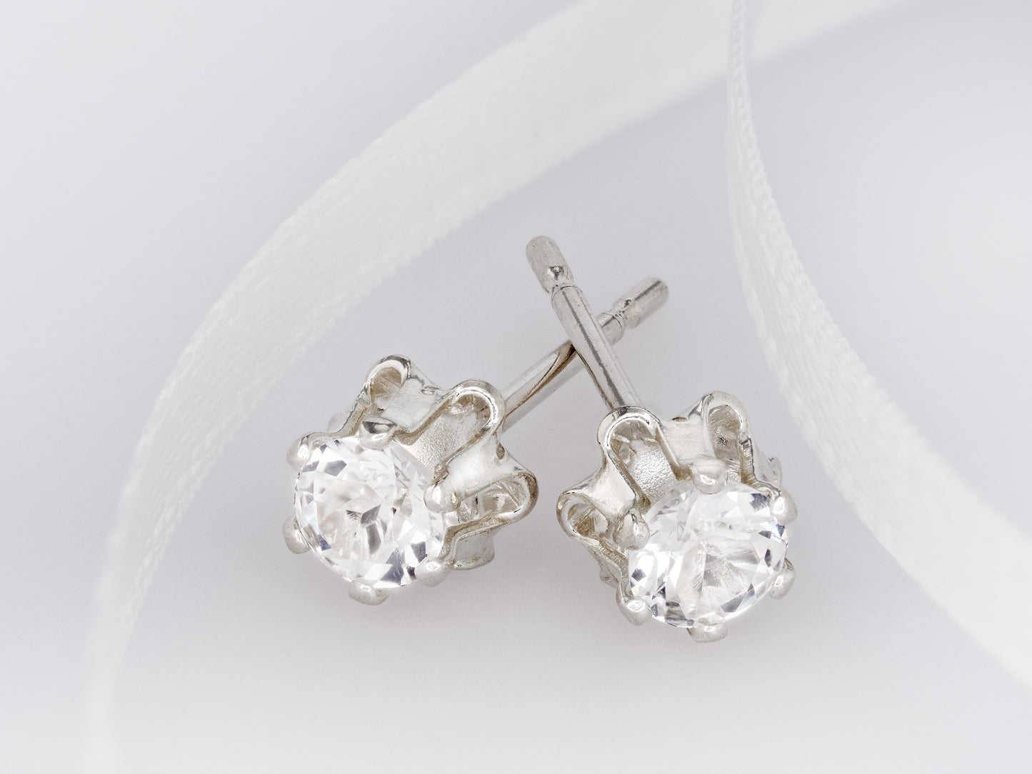 Natural Sparkling White Topaz earrings. Authentic Brazilian gemstones in a flower design. 3mm round gems. Sterling Silver.