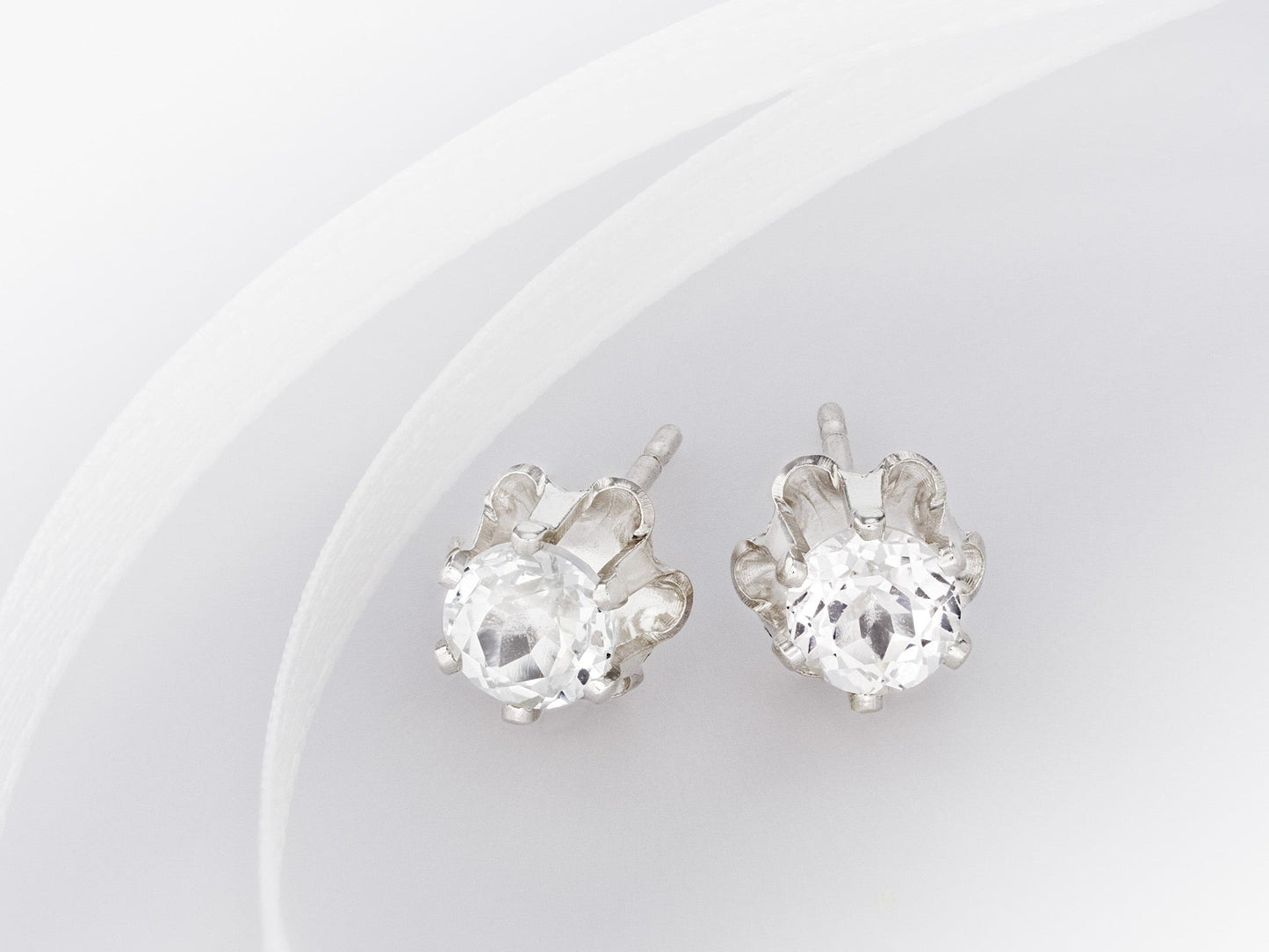 Natural 4mm Sparkling White Topaz earrings. Authentic Brazilian gemstones in a Clover design. Round faceted. Sterling Silver.