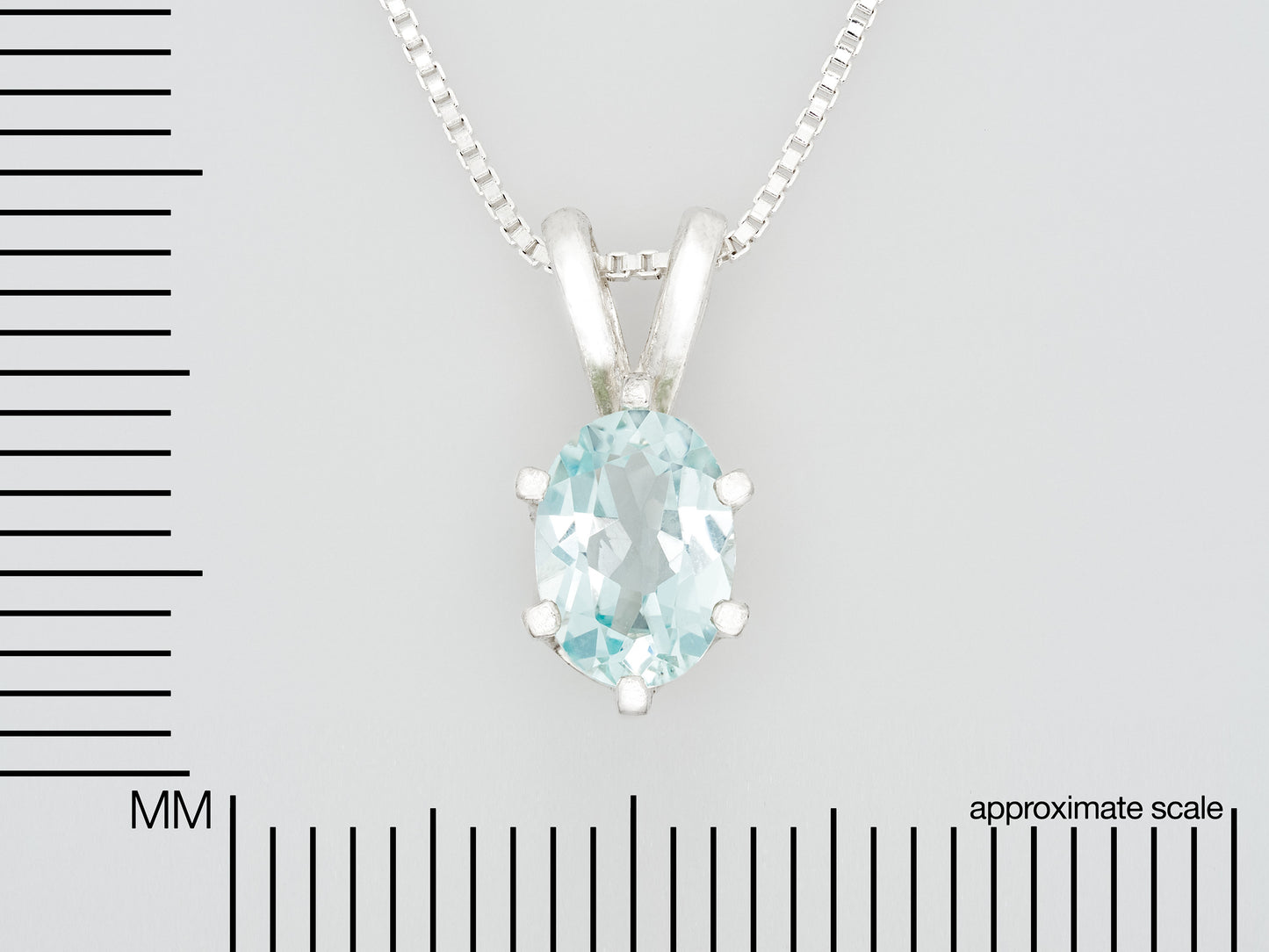 Light Blue Aquamarine Pendant and Chain from Brazil.  Wonderfully cut, 7x5mm Oval Gemstone.