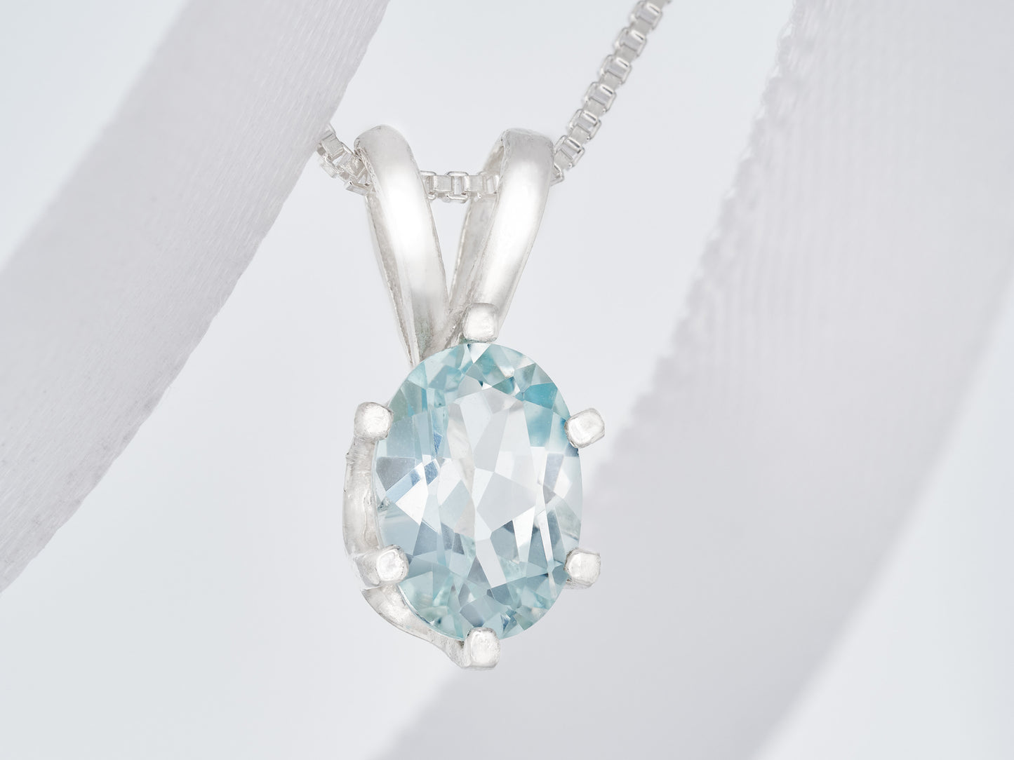 Light Blue Aquamarine Pendant and Chain from Brazil.  Wonderfully cut, 7x5mm Oval Gemstone.