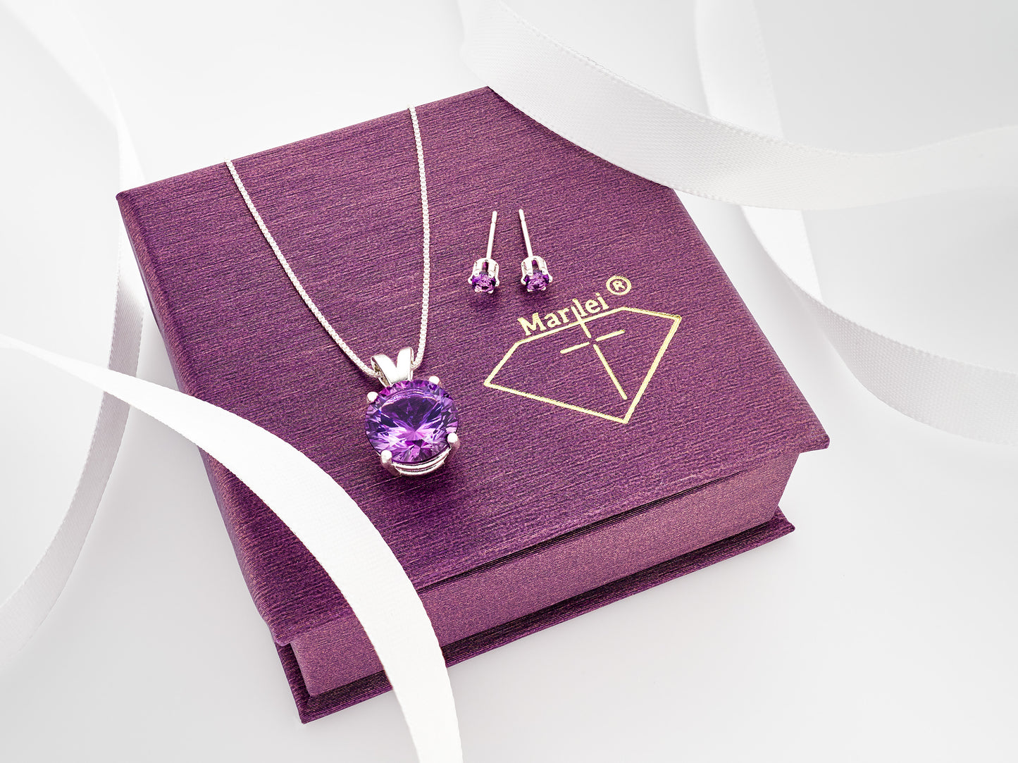 Brazilian amethyst necklace and earring set. Featuring a striking purple, 10mm round, concave cut amethyst pendant and matching 3mm earrings