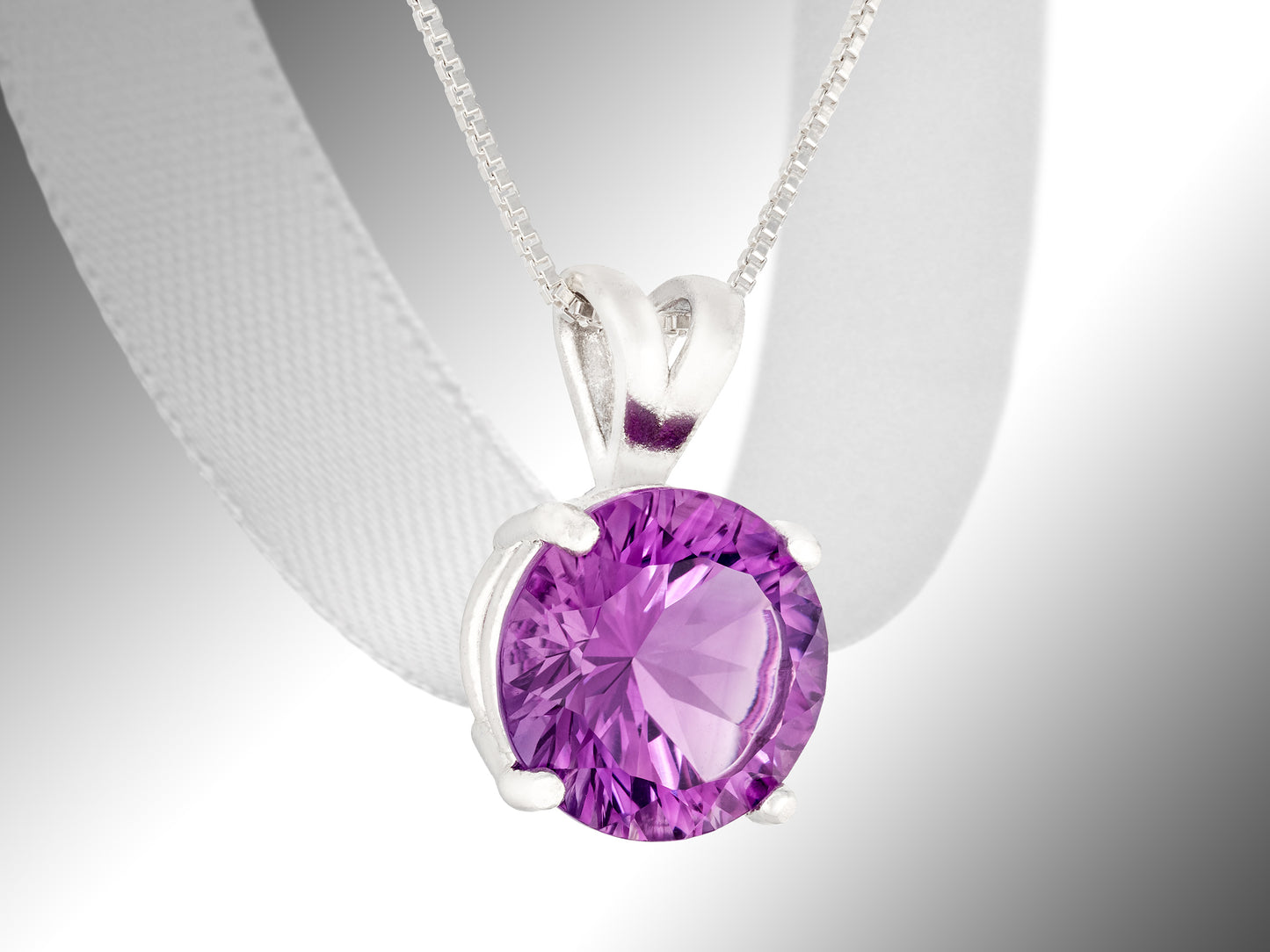 Brazilian amethyst necklace and earring set. Featuring a striking purple, 10mm round, concave cut amethyst pendant and matching 3mm earrings