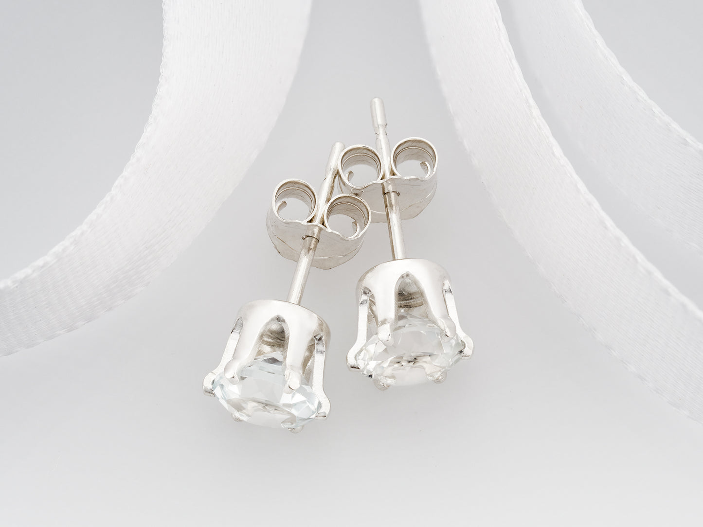 Striking, Natural, White Brazilian Topaz, Diamond Cut, 5mm Earrings.  6-Prong silver setting.