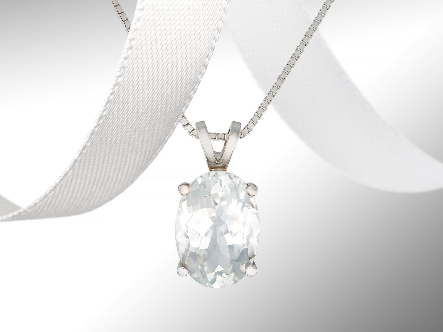 Magnificent white topaz gemstone pendant necklace. 14x10mm natural oval faceted Brazilian gemstone. 6.85ctw gem.