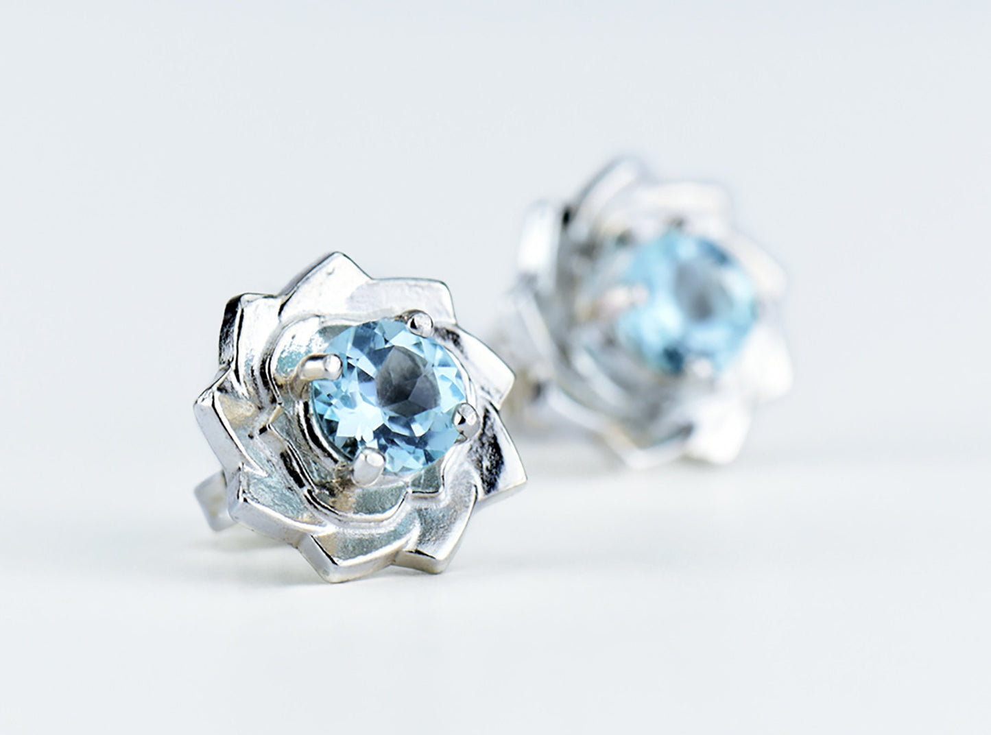 Light Blue Lotus Flower Earrings. Natural, Sky Blue Topaz gemstones set in handmade premium silver earrings.