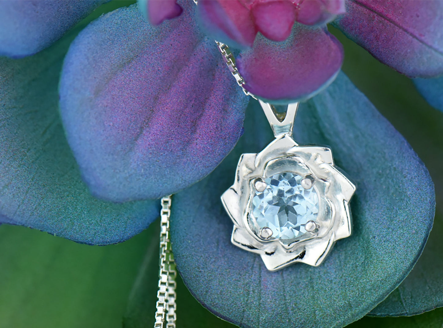 Light Blue Lotus Flower Pendant Necklace. Natural, Sky Blue Topaz gemstone set in handmade premium silver flower pendant.