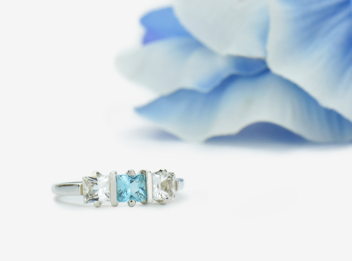 Genuine Brazilian Topaz Ring. 4x4mm Princess Cut gemstones. Swiss Blue Centerpiece with White Topaz Accents. Premium Sterling Silver.