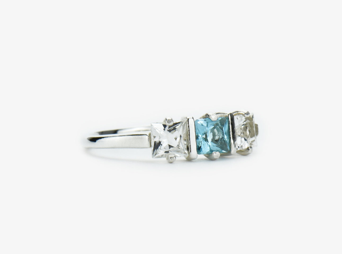 Genuine Brazilian Topaz Ring. 4x4mm Princess Cut gemstones. Swiss Blue Centerpiece with White Topaz Accents. Premium Sterling Silver.