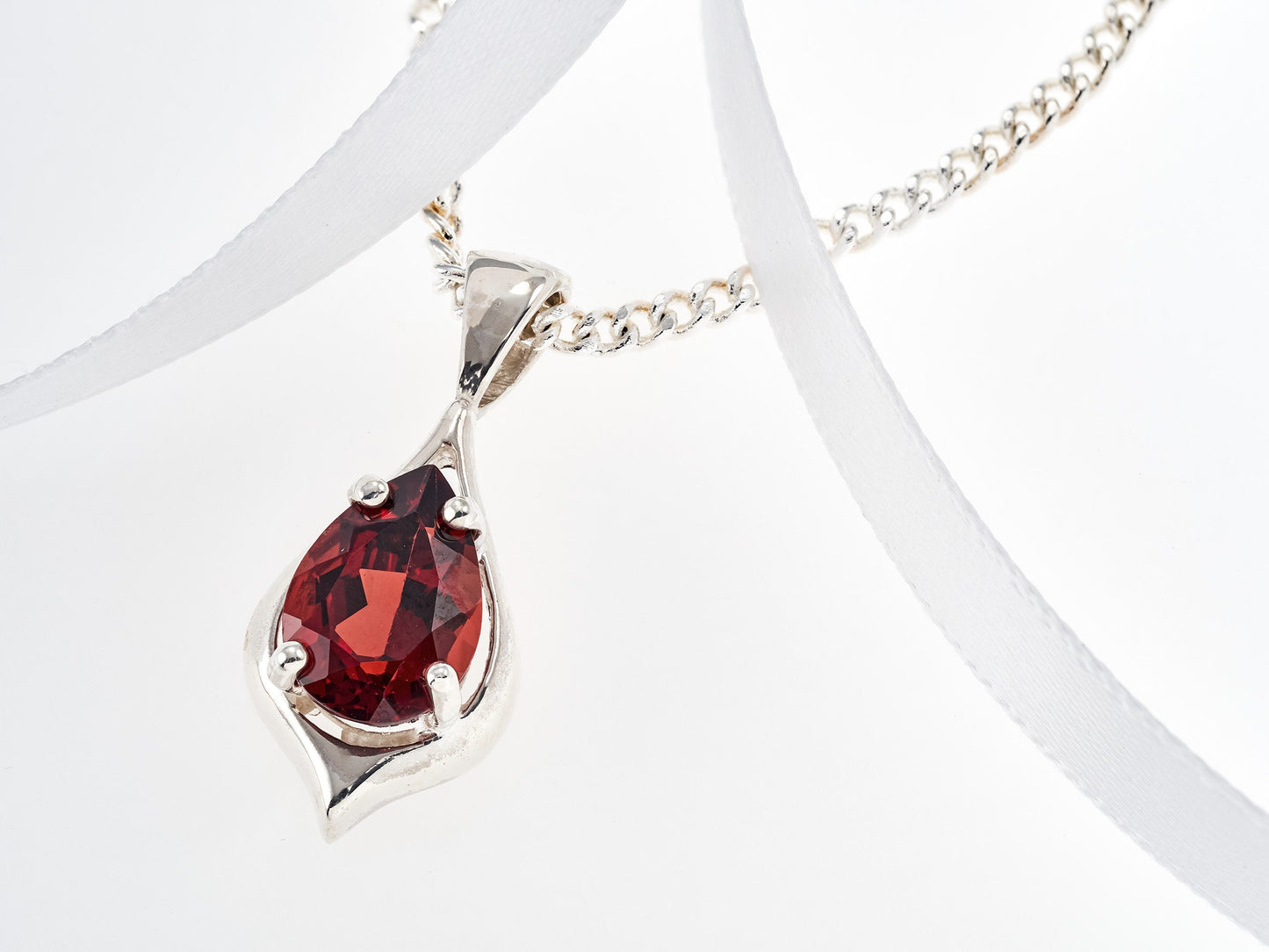 Handmade, striking red, garnet pendant necklace from Brazil. Pear, 10x7mm, 4-Prong, sterling silver pendant.