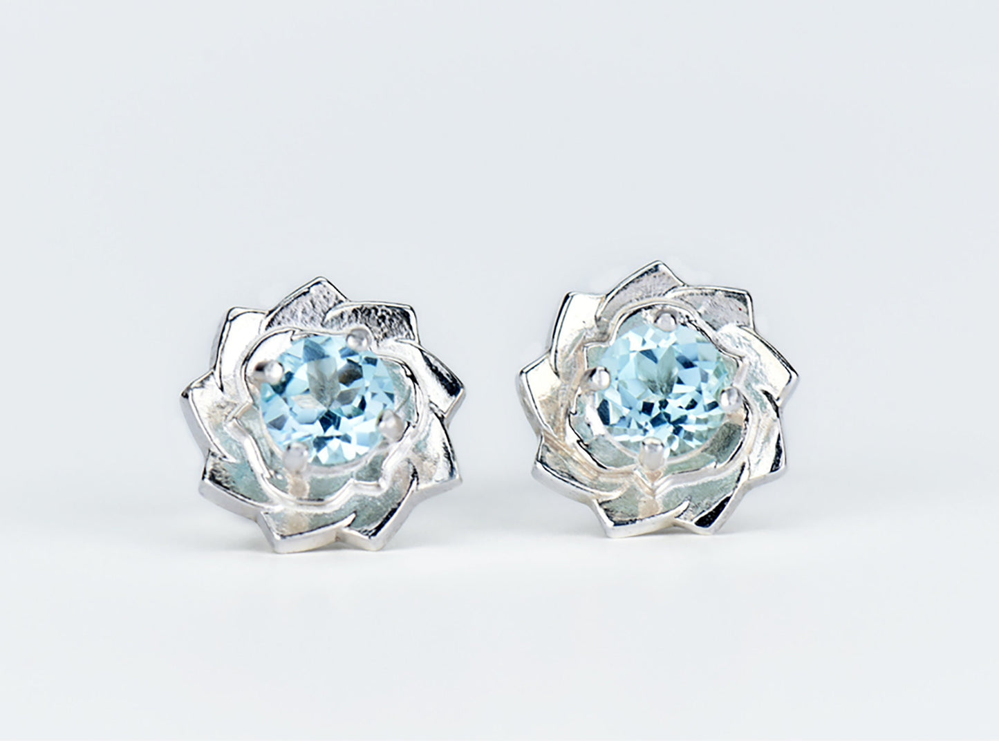 Light Blue Lotus Flower Earrings. Natural, Sky Blue Topaz gemstones set in handmade premium silver earrings.