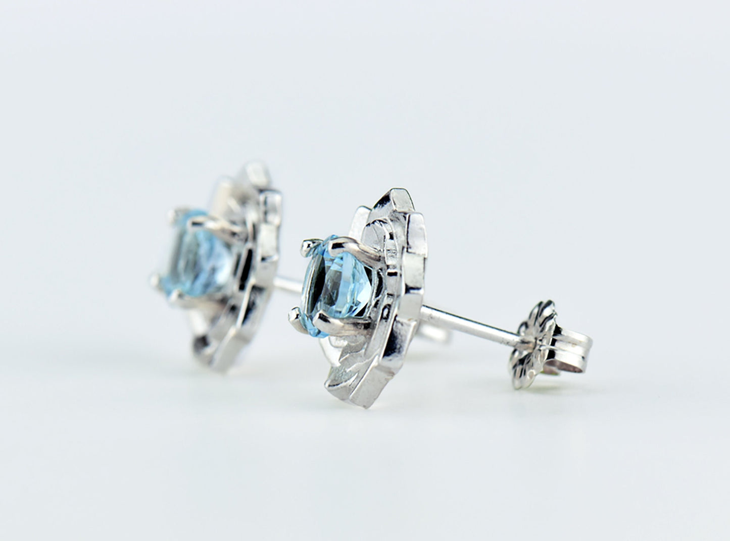 Light Blue Lotus Flower Earrings. Natural, Sky Blue Topaz gemstones set in handmade premium silver earrings.