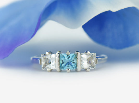 Genuine Brazilian Topaz Ring. 4x4mm Princess Cut gemstones. Swiss Blue Centerpiece with White Topaz Accents. Premium Sterling Silver.