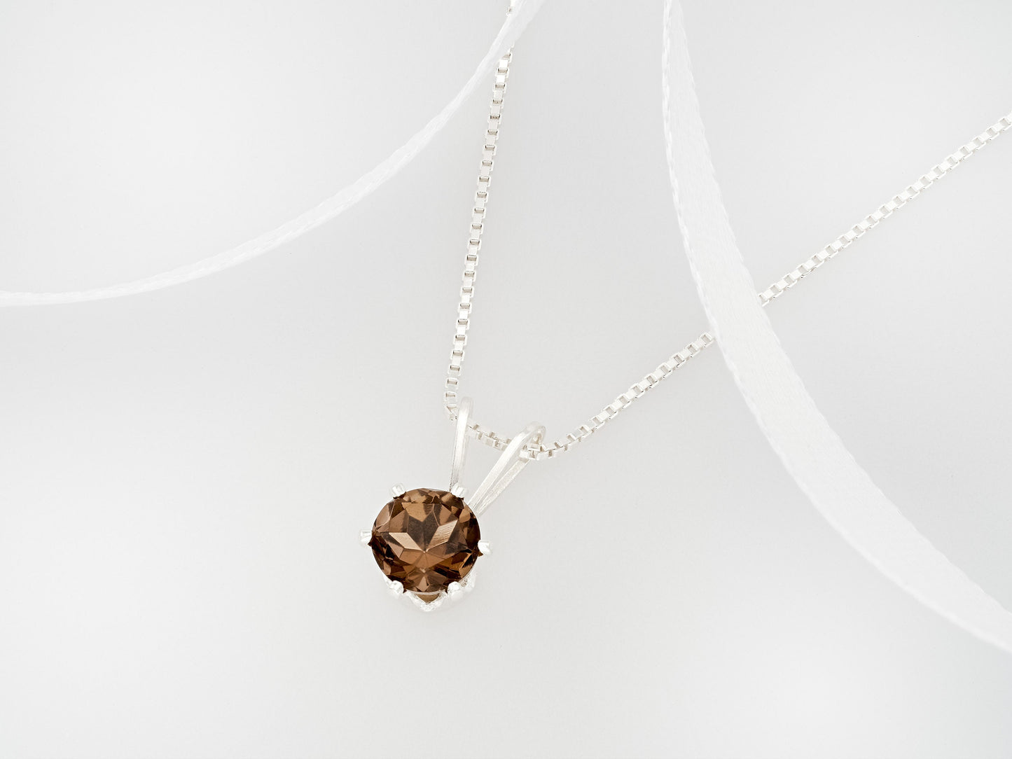 Beautiful brown smoky quartz necklace from Brazil!  5mm, round, natural Brazilian gemstone in a 6-Prong, Sterling Silver Pendant.