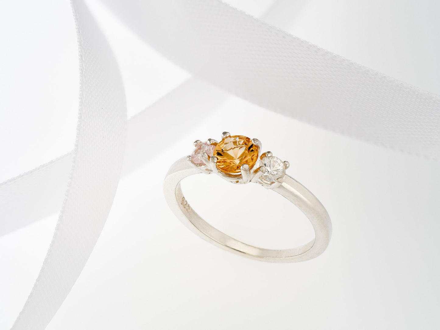 Imperial Topaz ring with white sapphire accents. Three Gem Ring featuring a 5 mm Imperial and 3 mm white sapphires.