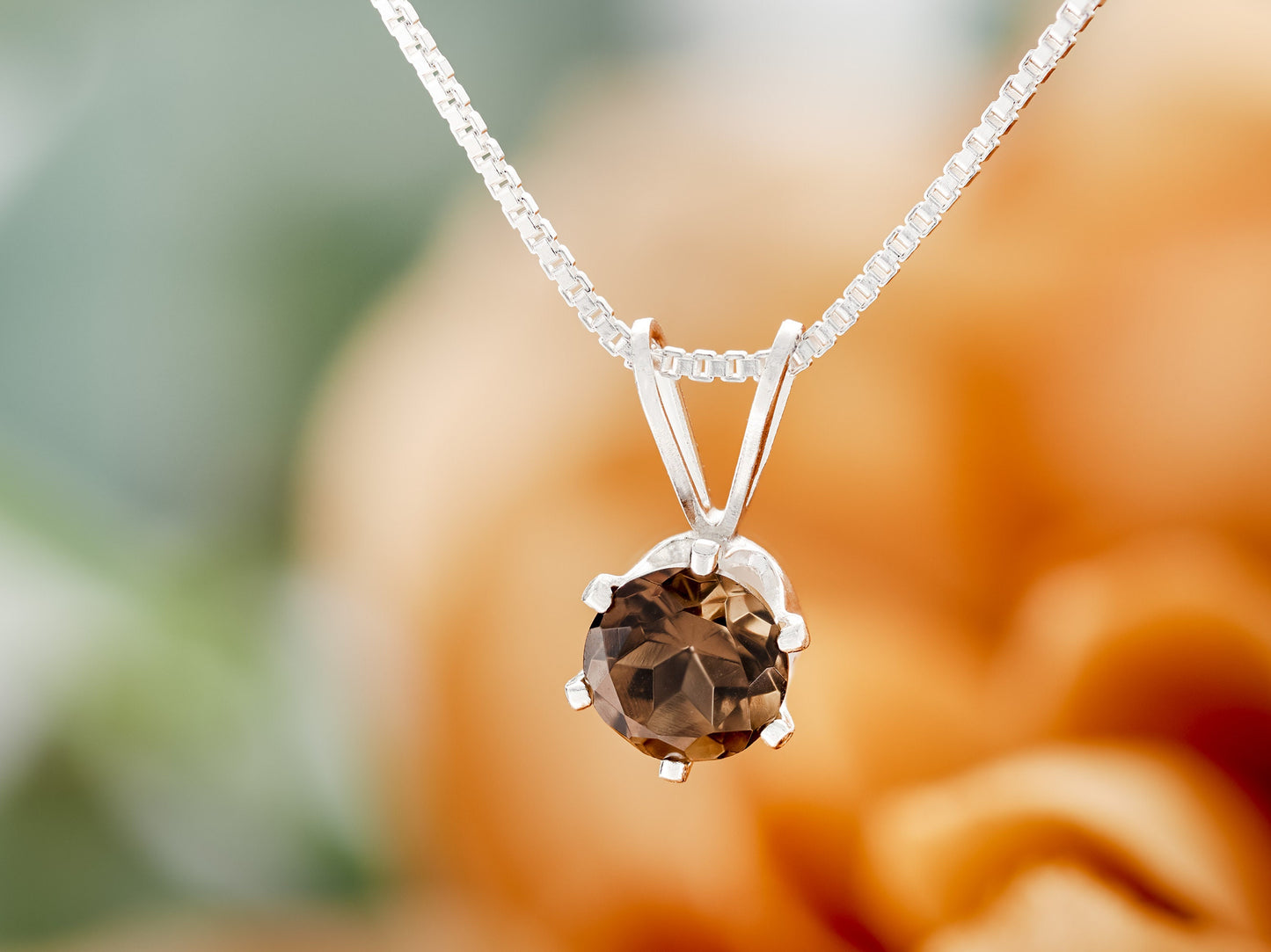 Beautiful brown smoky quartz necklace from Brazil!  5mm, round, natural Brazilian gemstone in a 6-Prong, Sterling Silver Pendant.