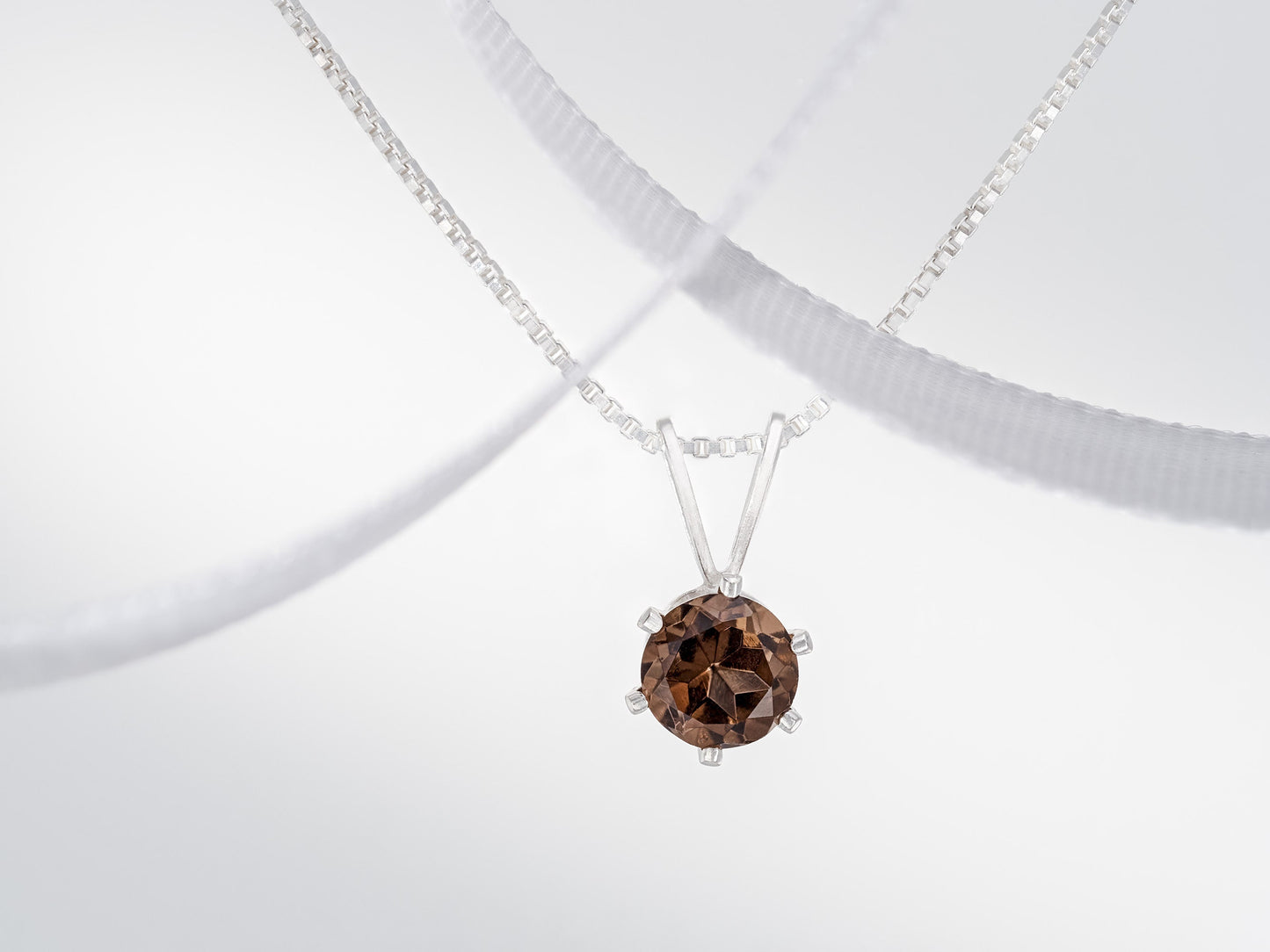 Beautiful brown smoky quartz necklace from Brazil!  5mm, round, natural Brazilian gemstone in a 6-Prong, Sterling Silver Pendant.