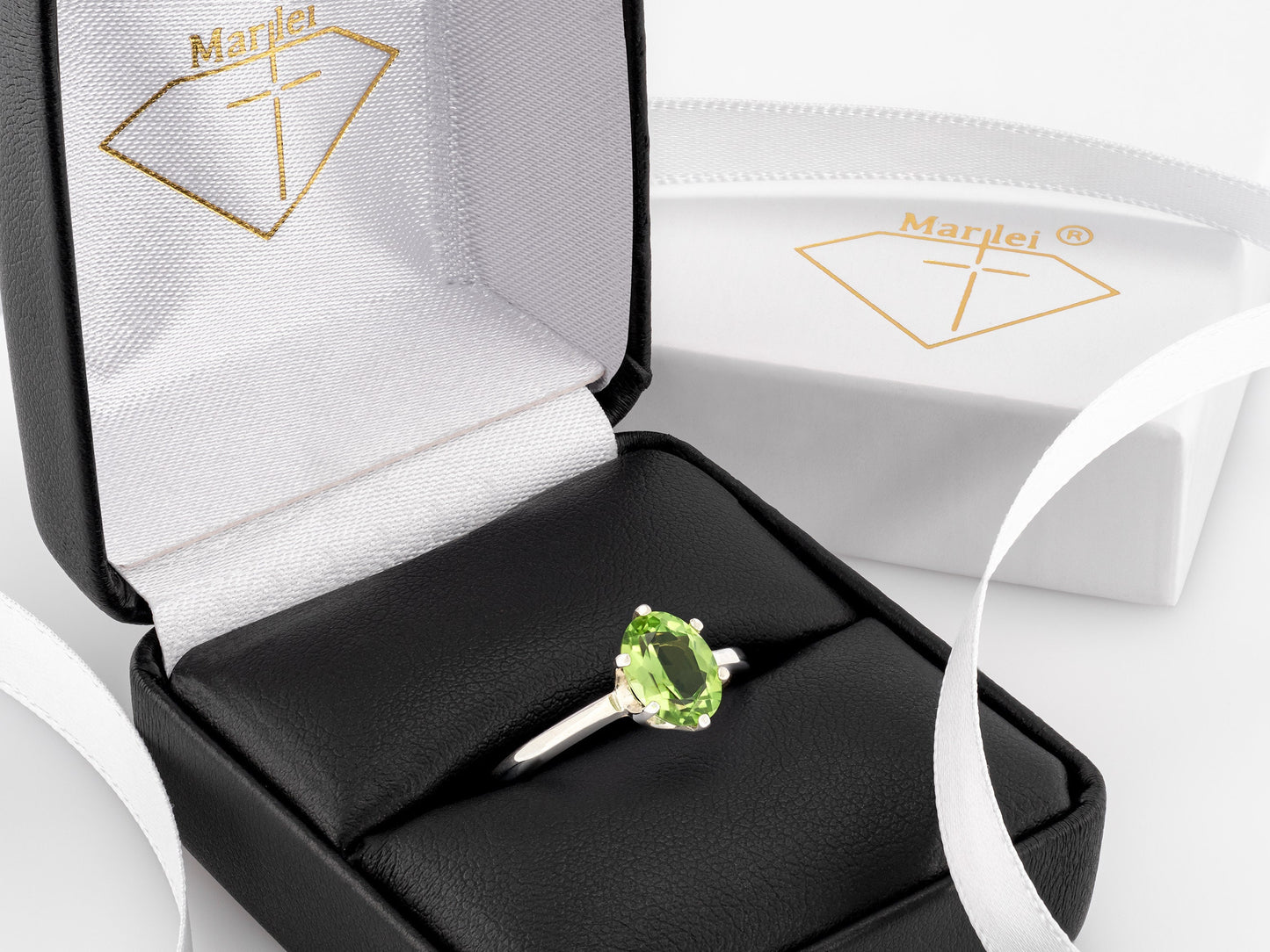 Sparkling green peridot ring. 8x6mm oval faceted natural peridot gemstone in sterling silver.