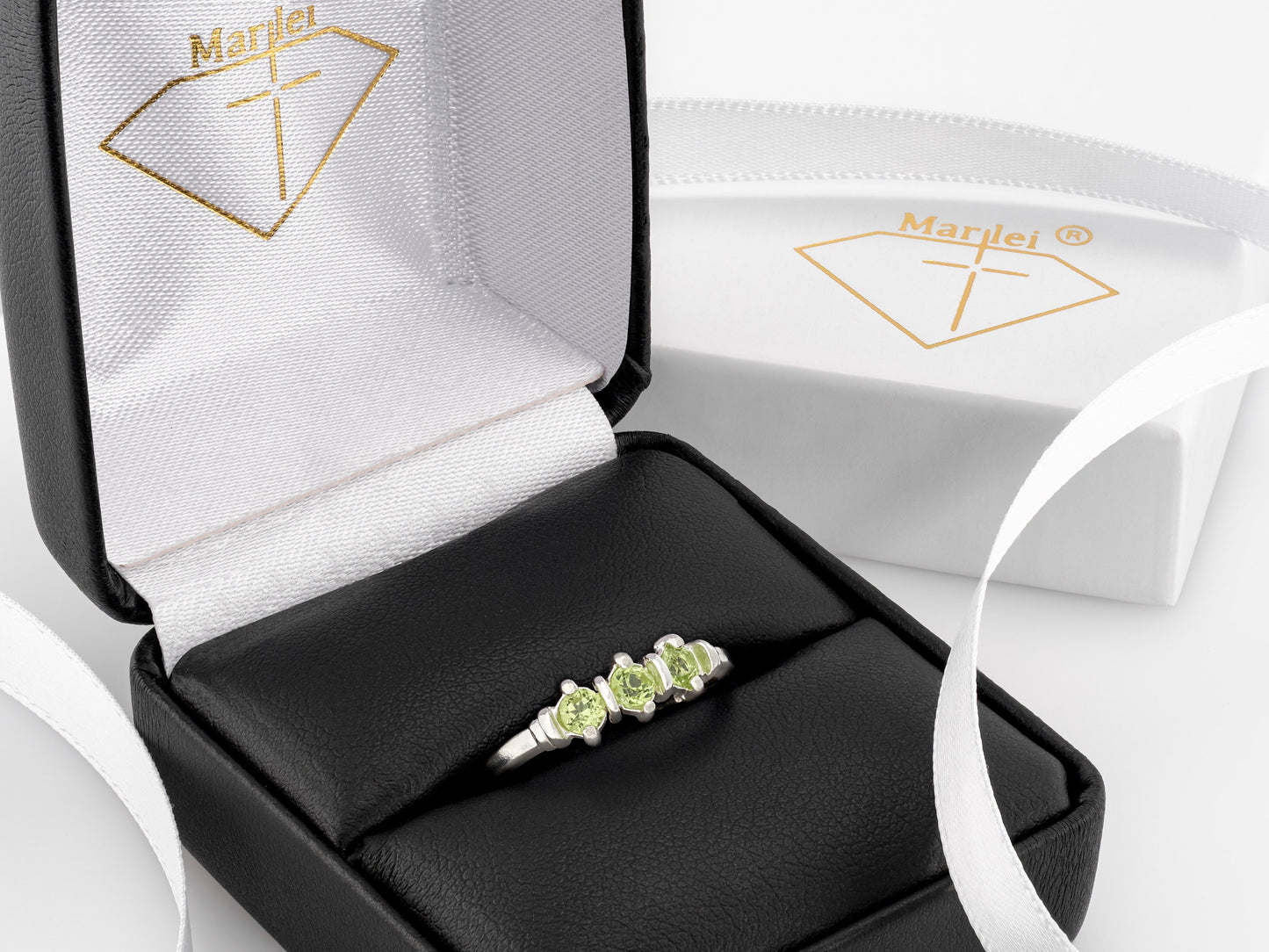 Three-Gemstone Band.  Lively green, natural, peridot!  Three Round Natural Peridot Gemstones set in Sterling Silver.