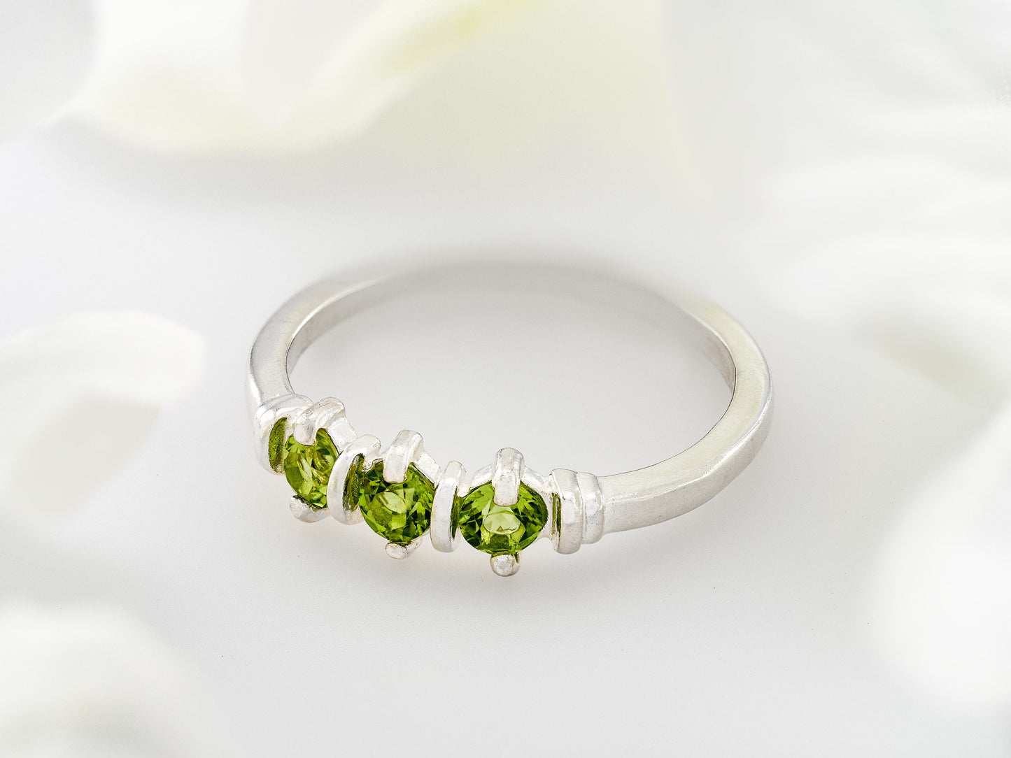 Three-Gemstone Band.  Lively green, natural, peridot!  Three Round Natural Peridot Gemstones set in Sterling Silver.