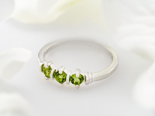 Three-Gemstone Band.  Lively green, natural, peridot!  Three Round Natural Peridot Gemstones set in Sterling Silver.