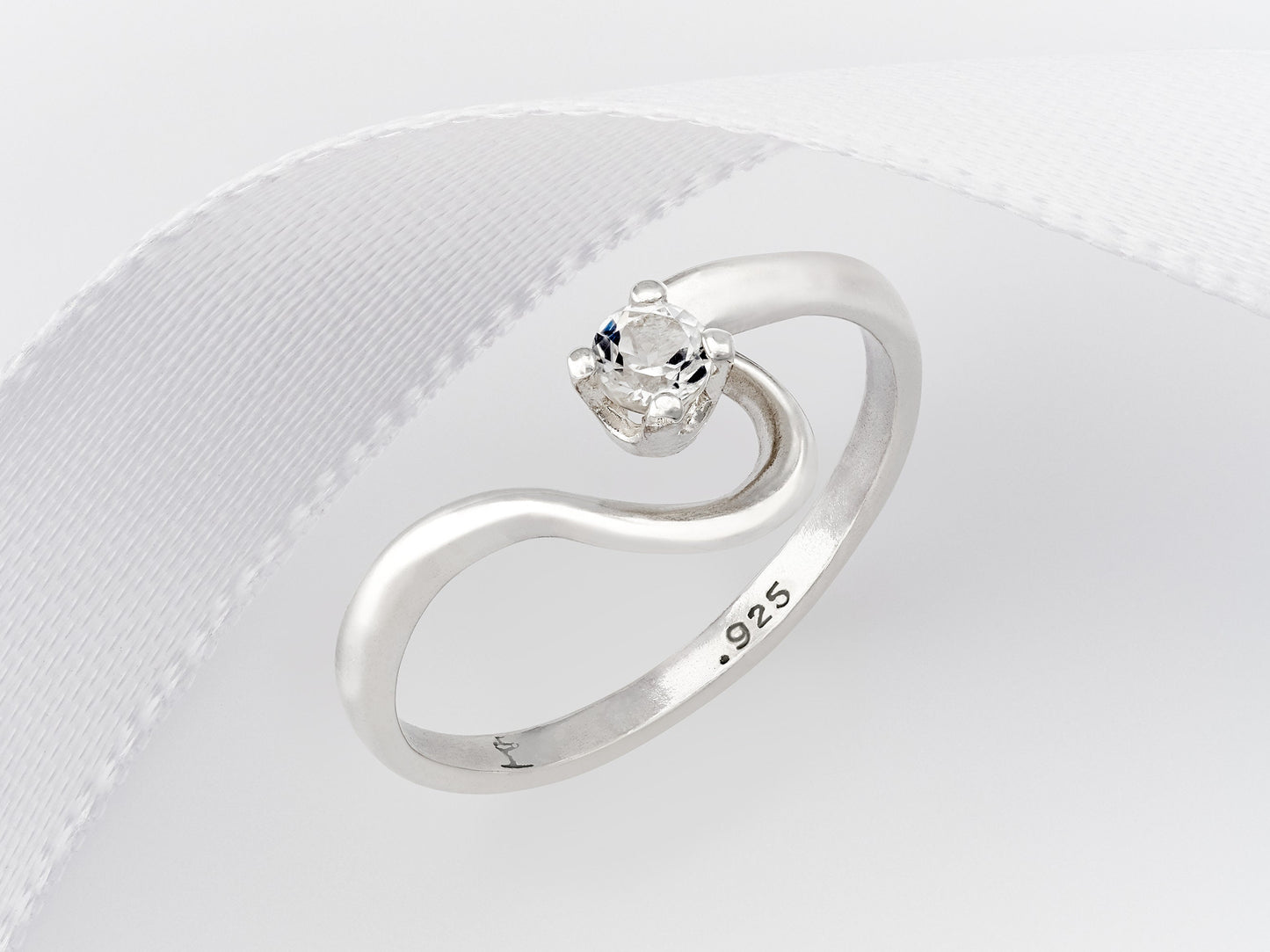 April birthstone, petite half heart style silver ring. 3mm round faceted White Topaz as the diamond alternative.