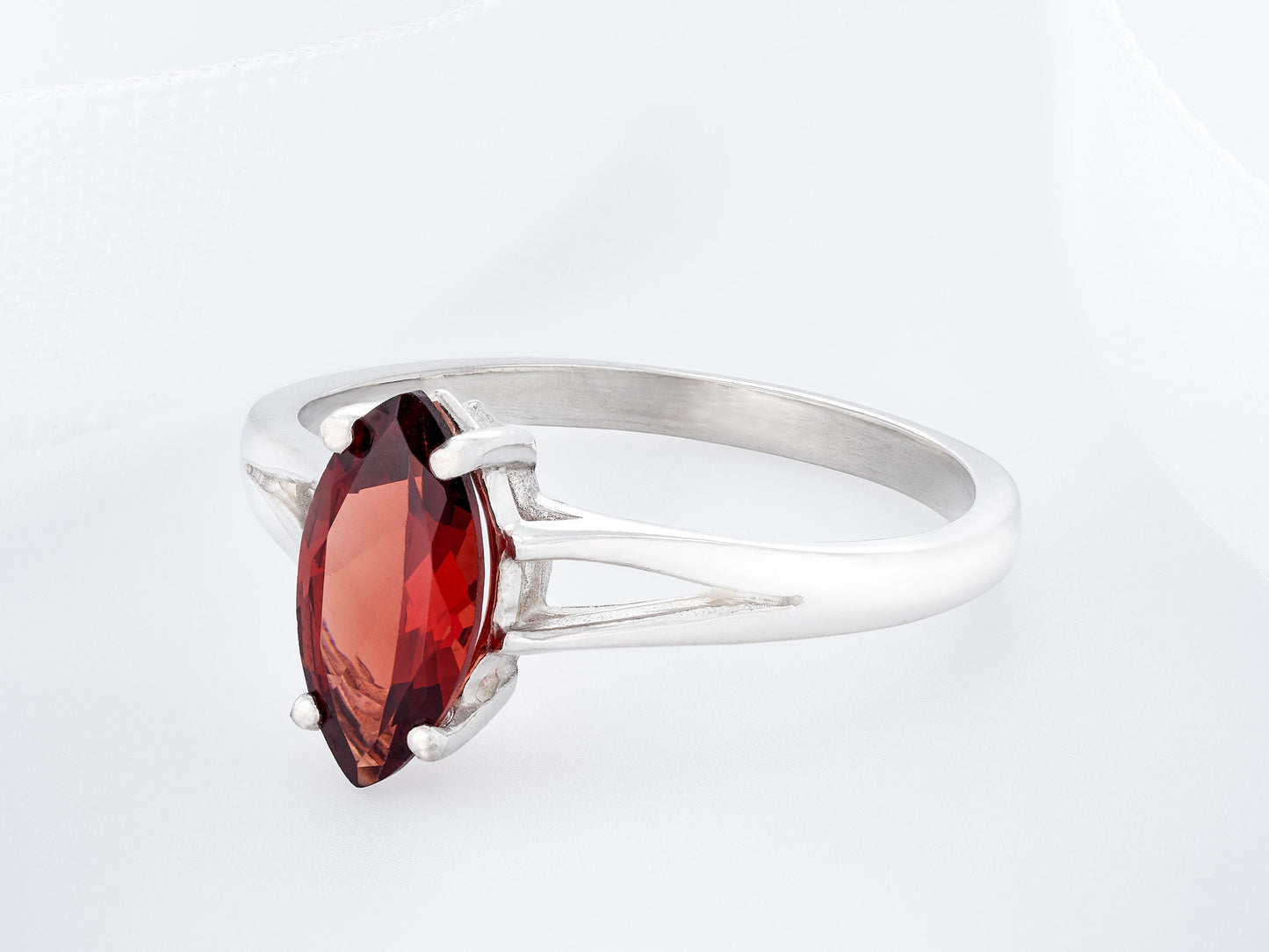 Marquise Mozambique Garnet.  Gorgeous color!  10x5mm size is perfect.  Premium Silver ring in your select size.