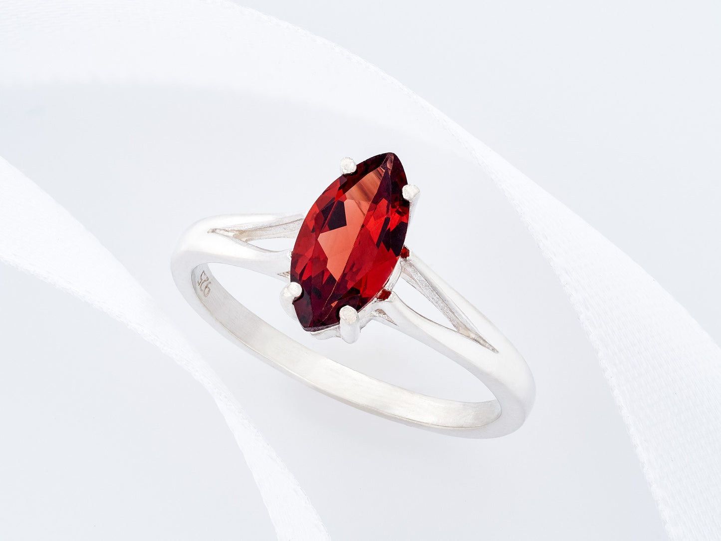 Marquise Mozambique Garnet.  Gorgeous color!  10x5mm size is perfect.  Premium Silver ring in your select size.