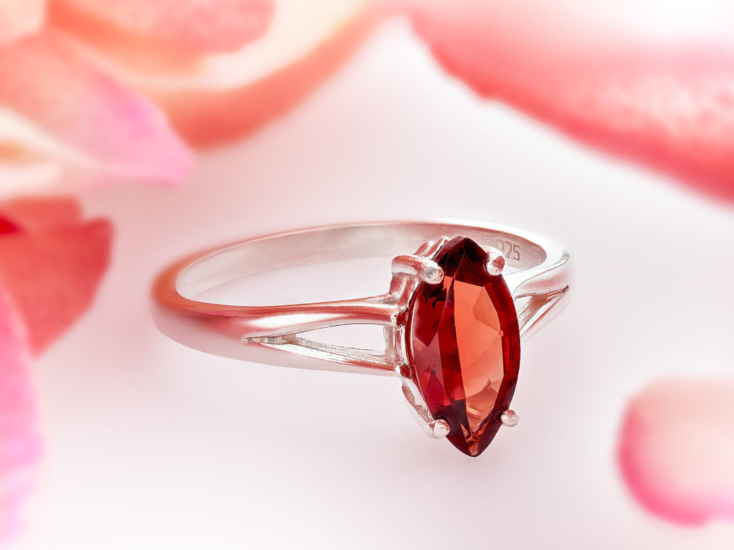 Marquise Mozambique Garnet.  Gorgeous color!  10x5mm size is perfect.  Premium Silver ring in your select size.