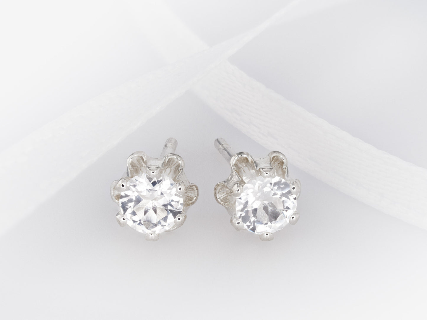 Natural Sparkling White Topaz earrings. Authentic Brazilian gemstones in a flower design. 3mm round gems. Sterling Silver.