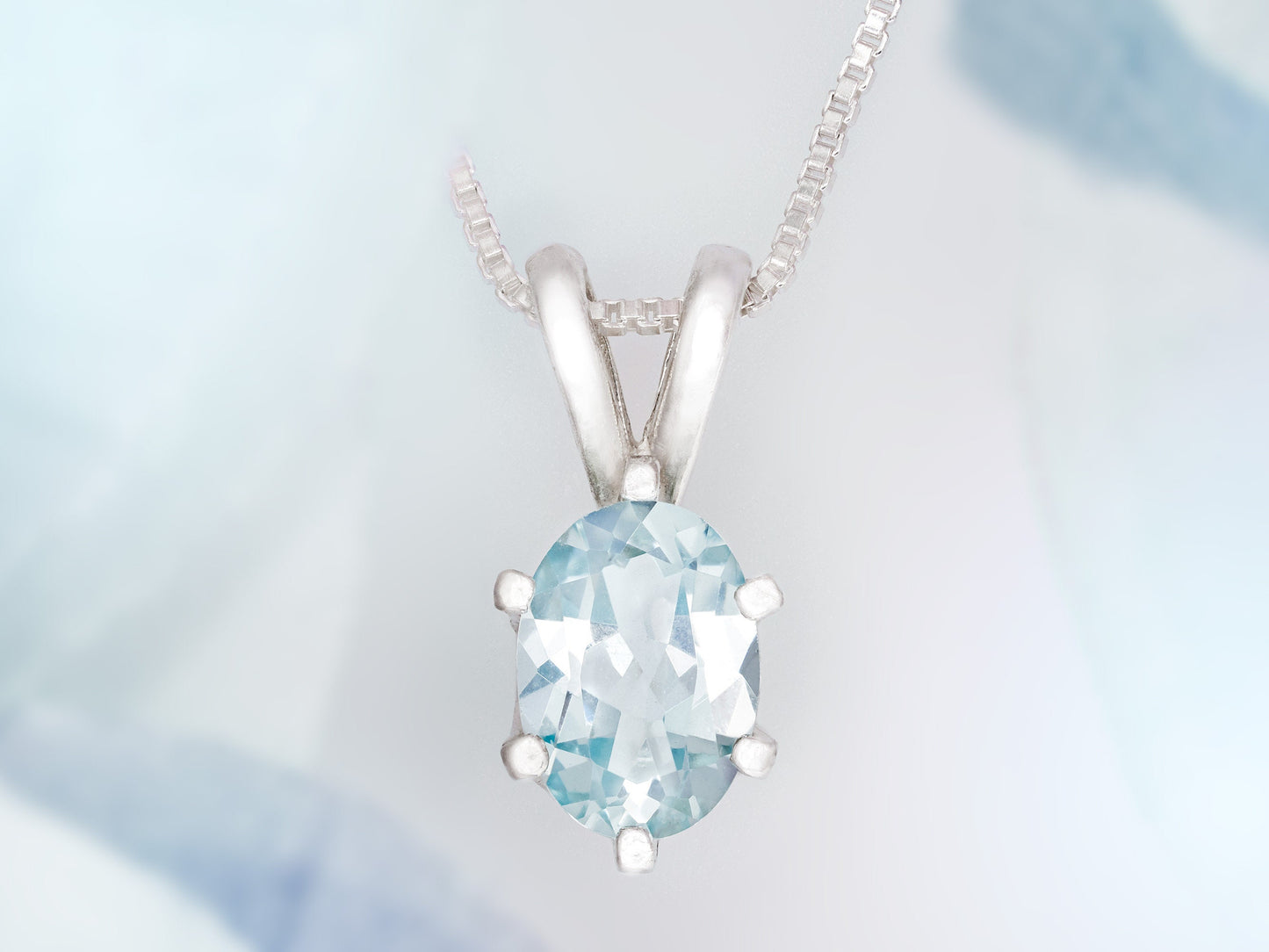 Light Blue Aquamarine Pendant and Chain from Brazil.  Wonderfully cut, 7x5mm Oval Gemstone.