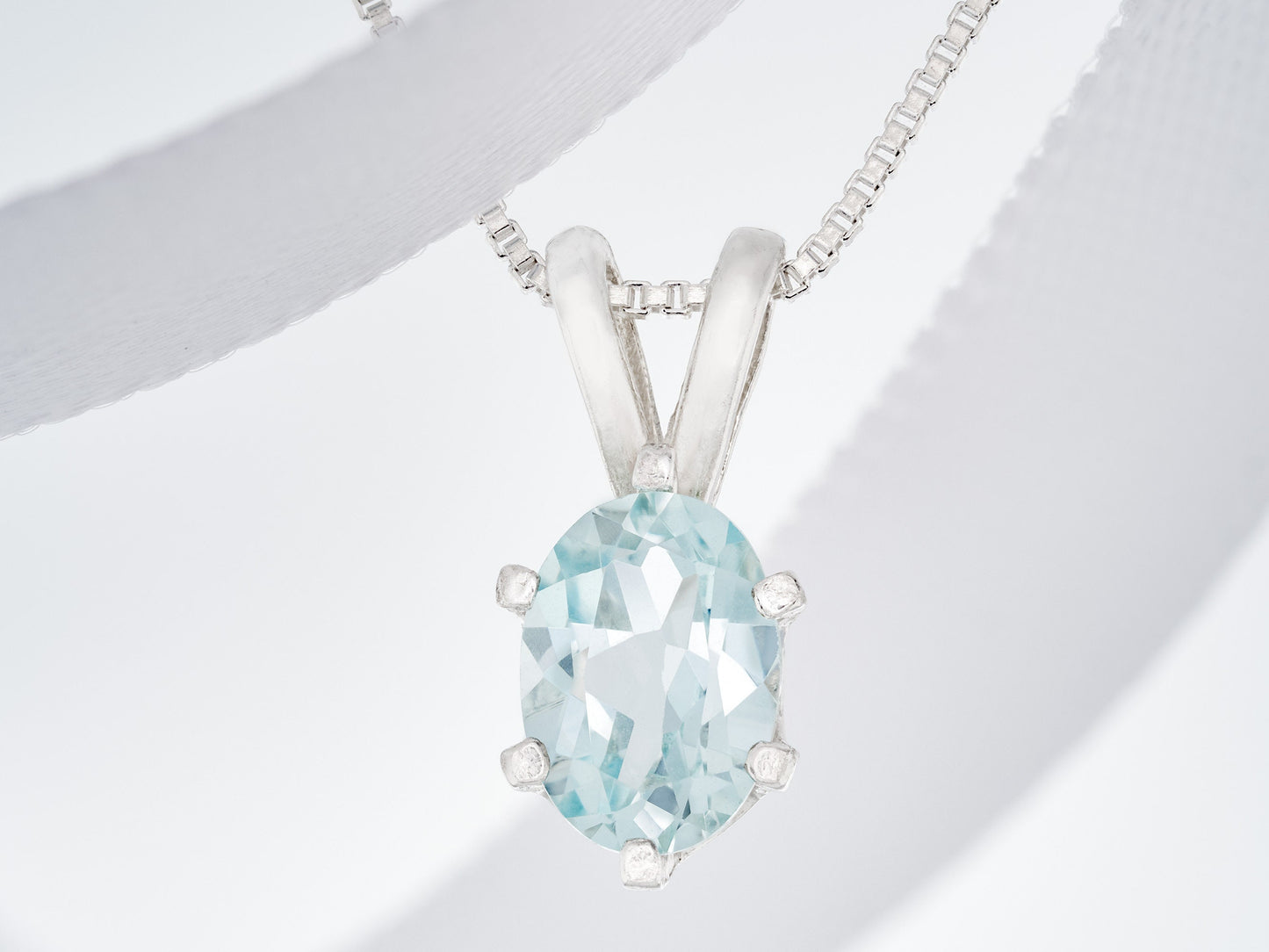 Light Blue Aquamarine Pendant and Chain from Brazil.  Wonderfully cut, 7x5mm Oval Gemstone.