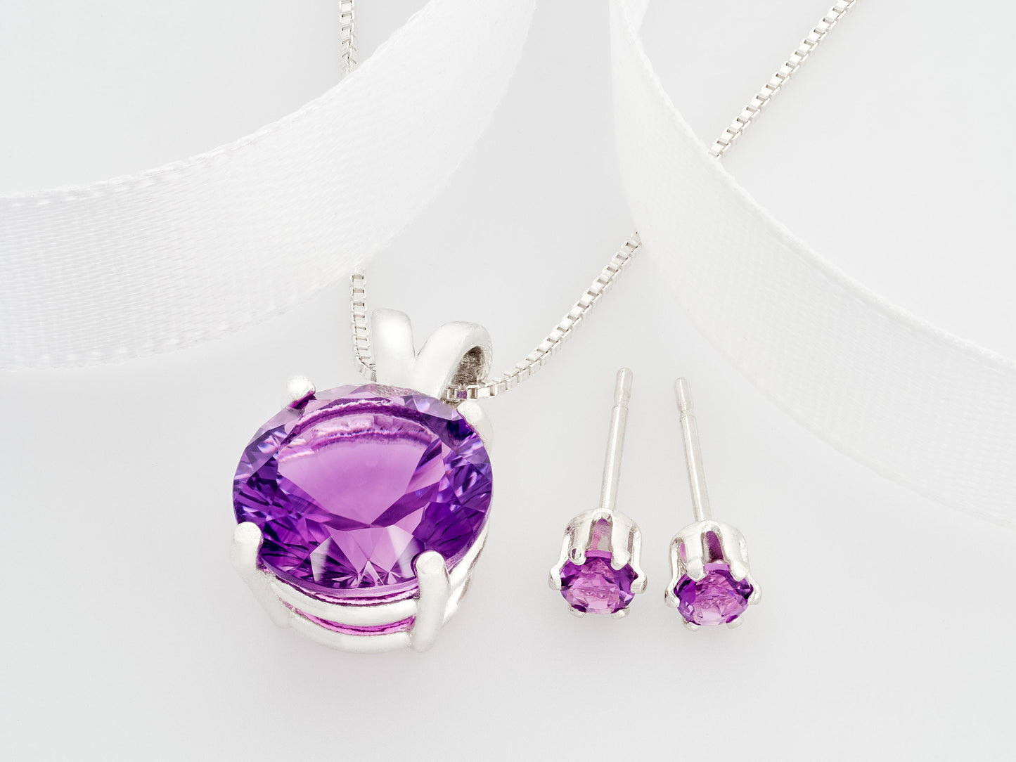 Brazilian amethyst necklace and earring set. Featuring a striking purple, 10mm round, concave cut amethyst pendant and matching 3mm earrings