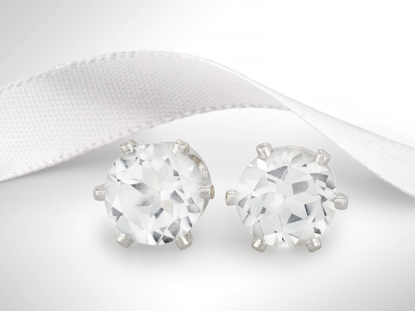 Striking, Natural, White Brazilian Topaz, Diamond Cut, 5mm Earrings.  6-Prong silver setting.