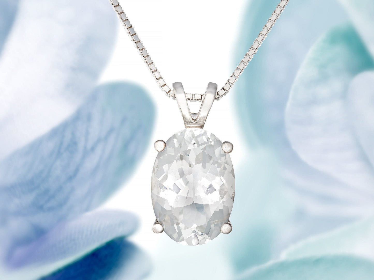 Magnificent white topaz gemstone pendant necklace. 14x10mm natural oval faceted Brazilian gemstone. 6.85ctw gem.