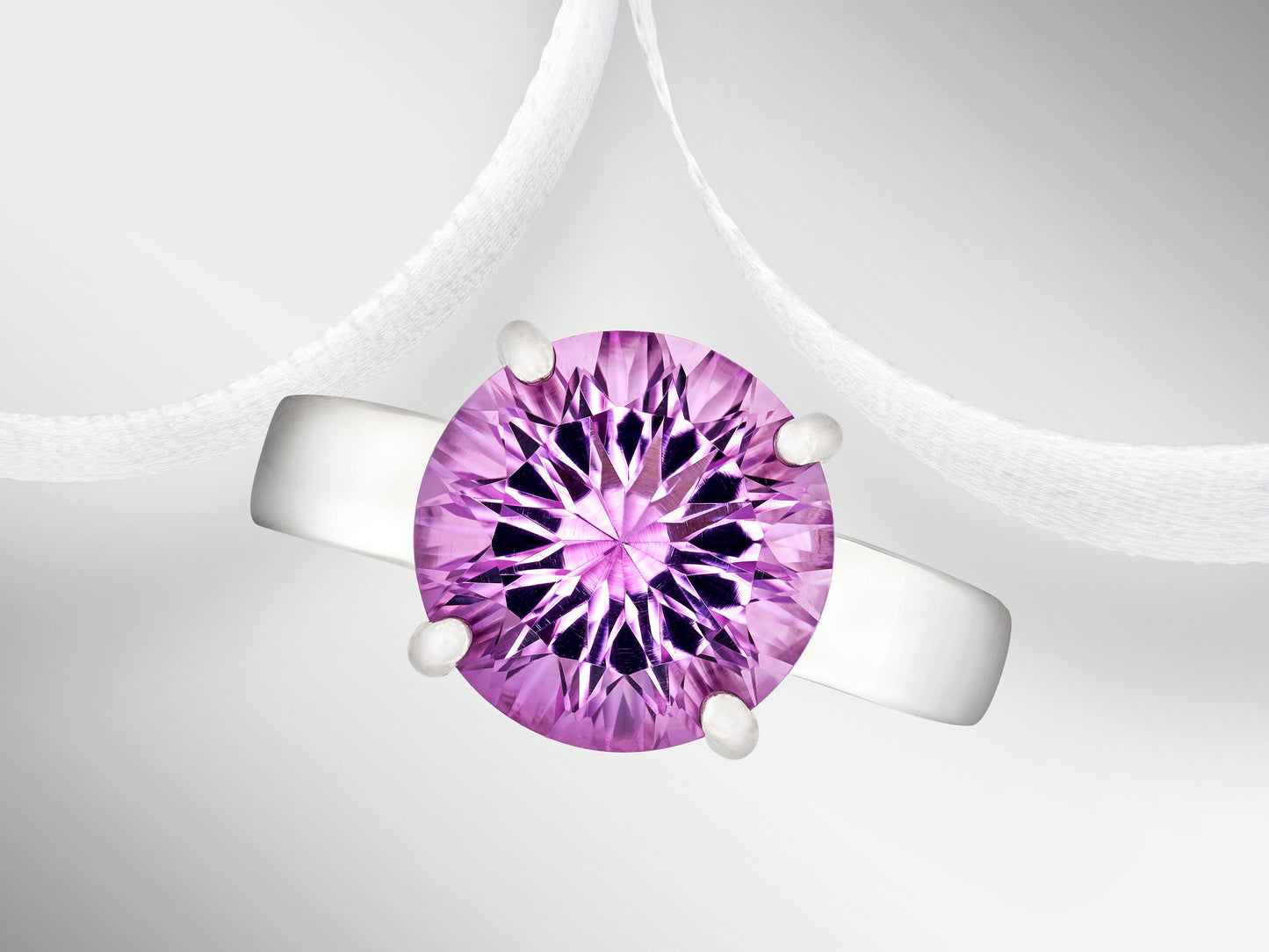 Special Edition Brazilian Amethyst ring.  Grade AAA, natural concave cut round gemstone set in premium silver. IF Clarity, 3.4ctw.