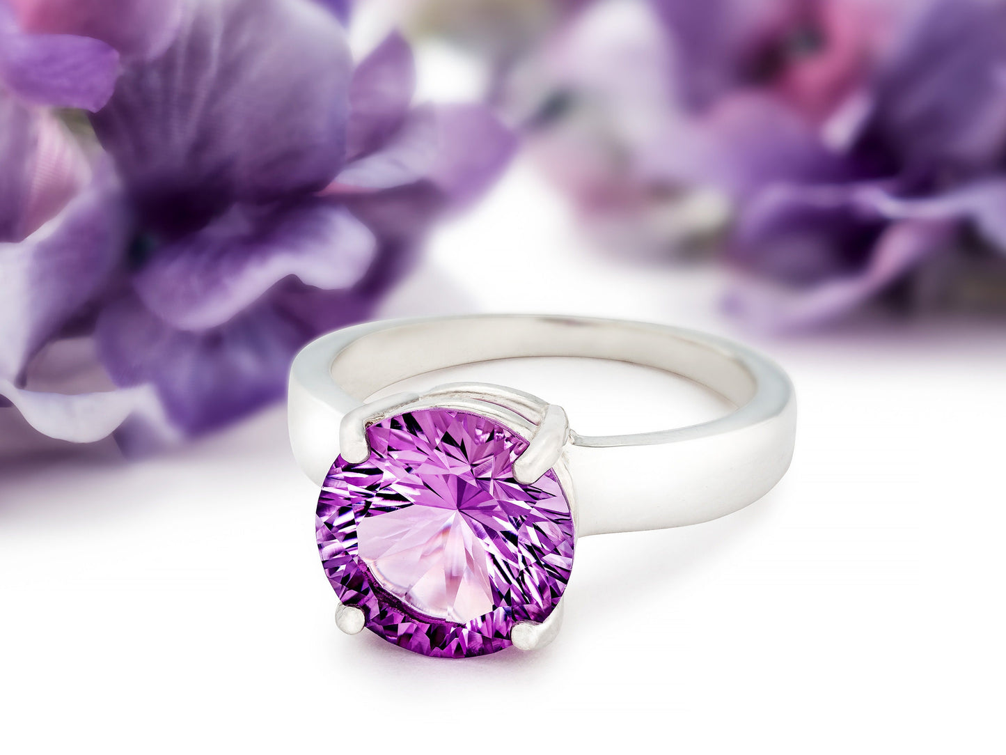 Special Edition Brazilian Amethyst ring.  Grade AAA, natural concave cut round gemstone set in premium silver. IF Clarity, 3.4ctw.