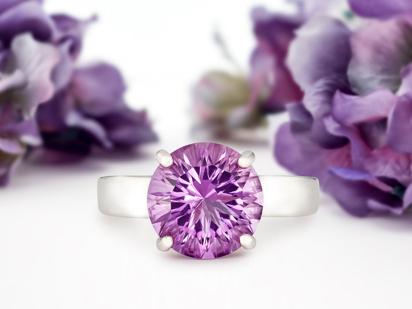 Special Edition Brazilian Amethyst ring.  Grade AAA, natural concave cut round gemstone set in premium silver. IF Clarity, 3.4ctw.