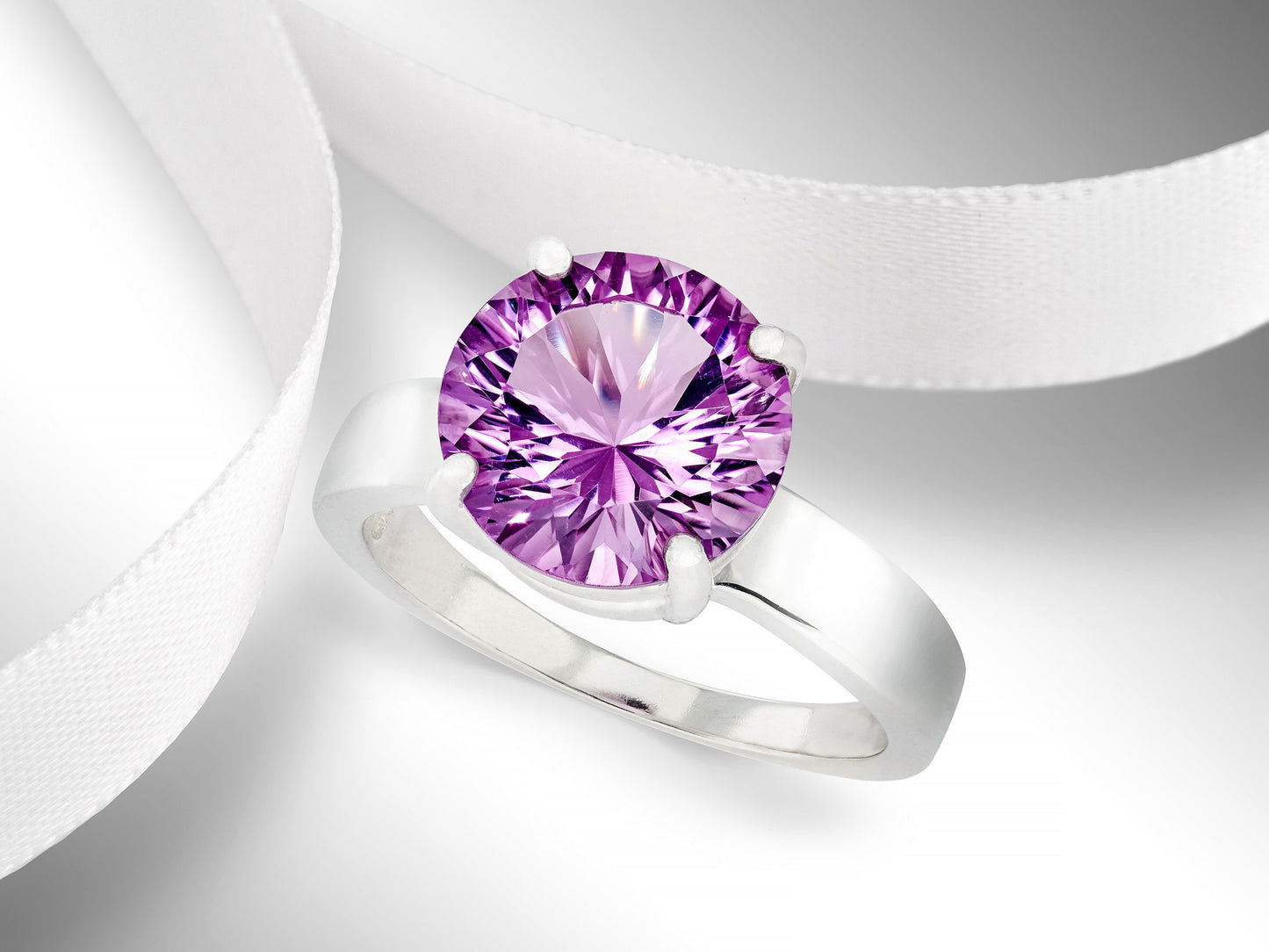 Special Edition Brazilian Amethyst ring.  Grade AAA, natural concave cut round gemstone set in premium silver. IF Clarity, 3.4ctw.