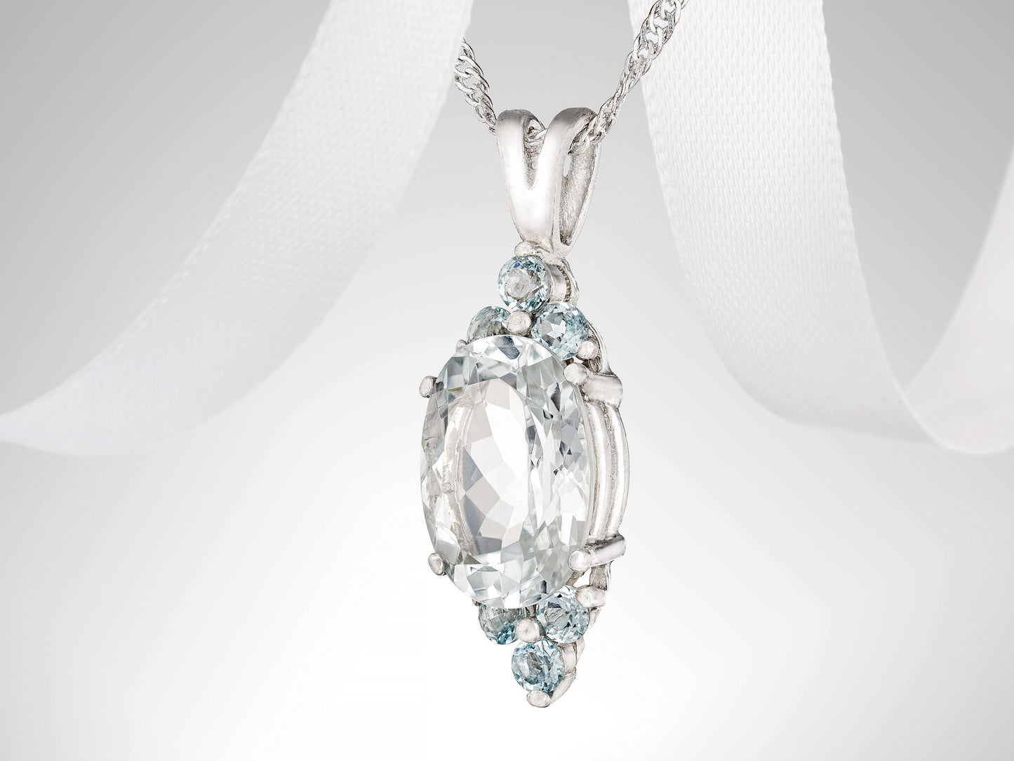 Unique, handmade, natural white topaz and aquamarine gemstone pendant necklace. 14x10mm oval, faceted, Brazilian topaz, light blue accents.