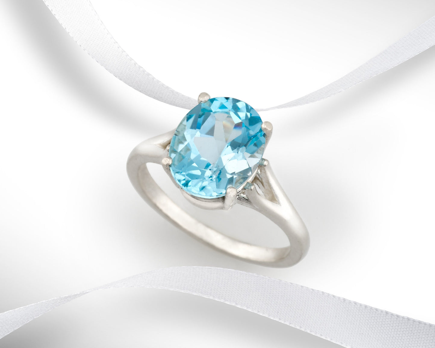 Fine Grade Sky Blue Topaz Ring in silver. Beautiful Color! Wonderful cut and clarity. Genuine Brazilian Gemstone! 11x9mm Oval, 4+ ctw.