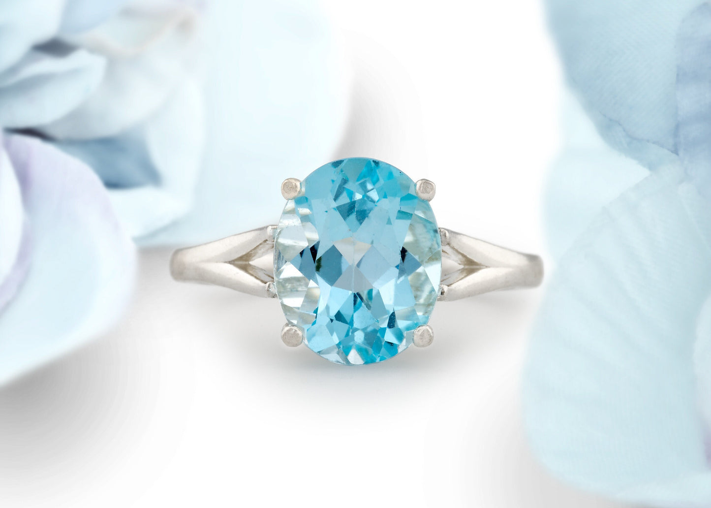 Fine Grade Sky Blue Topaz Ring in silver. Beautiful Color! Wonderful cut and clarity. Genuine Brazilian Gemstone! 11x9mm Oval, 4+ ctw.