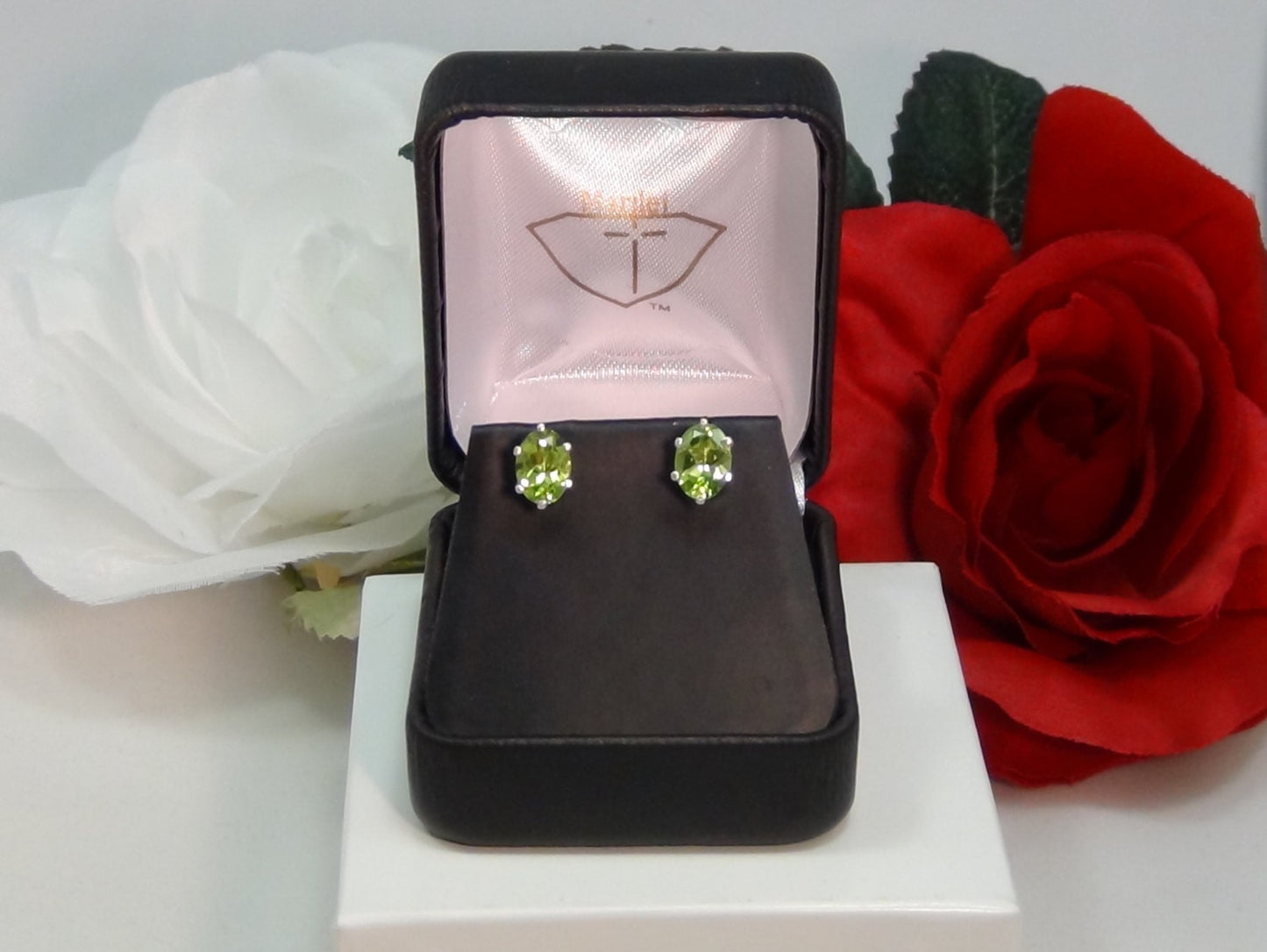 Vivid Green Peridot Earrings. Striking! 8mm x 6mm Oval Shape. Sterling Silver. Backs, case, and gift box provided.