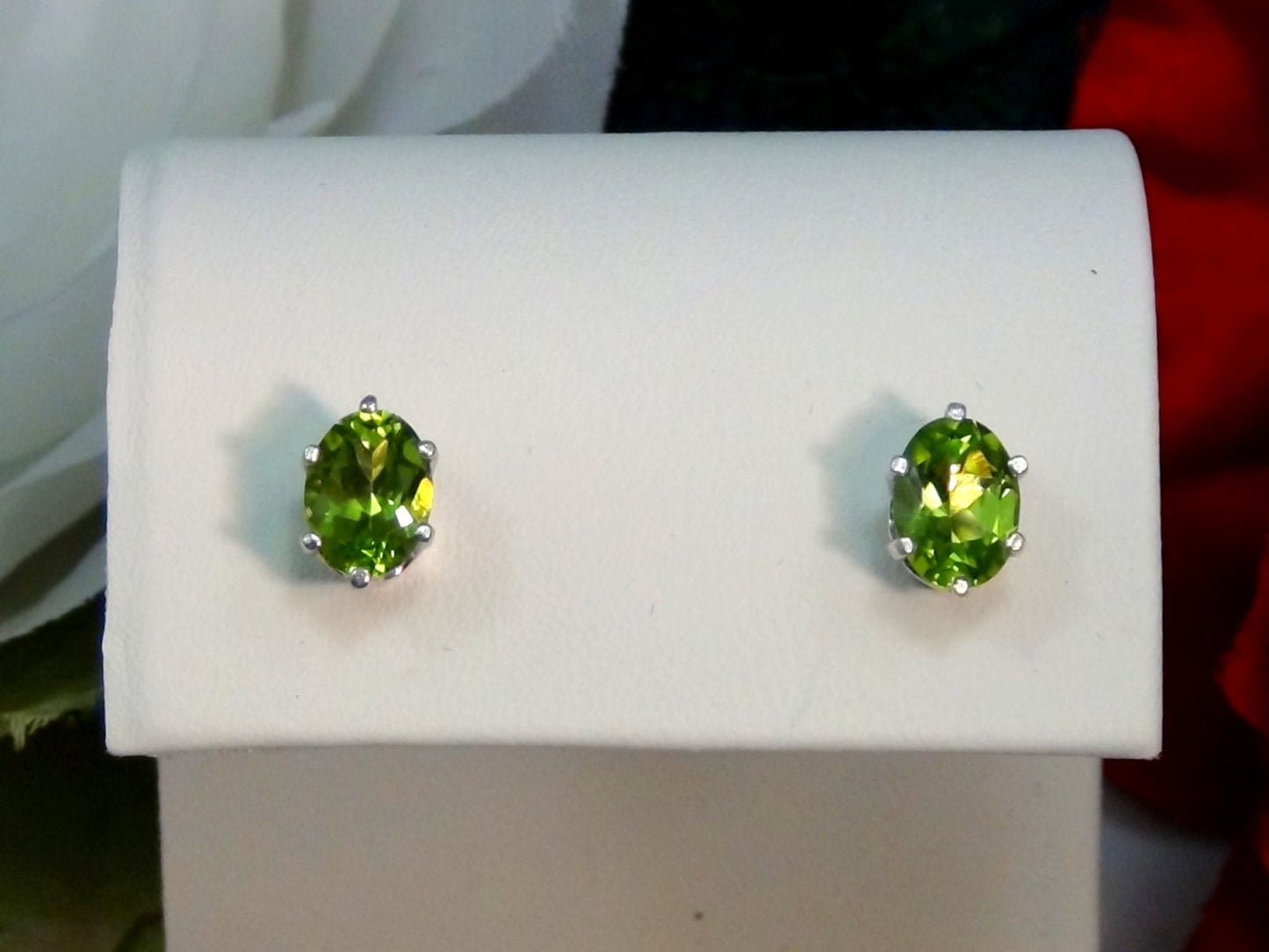 Vivid Green Peridot Earrings. Striking! 8mm x 6mm Oval Shape. Sterling Silver. Backs, case, and gift box provided.